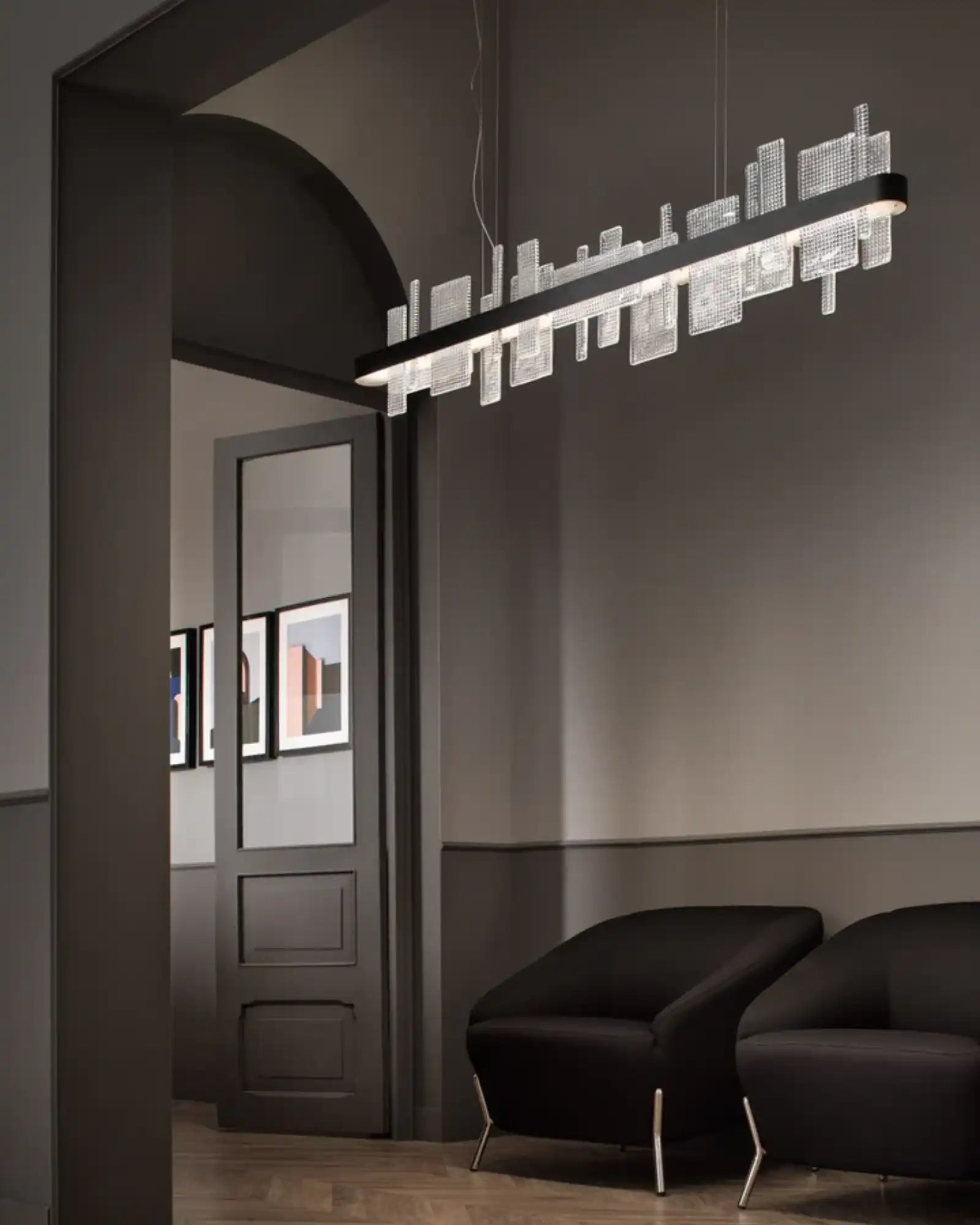 Ribbon Linear Pendant Light by Masiero Lighting featured within a contemporary lounge area | Nook Collections