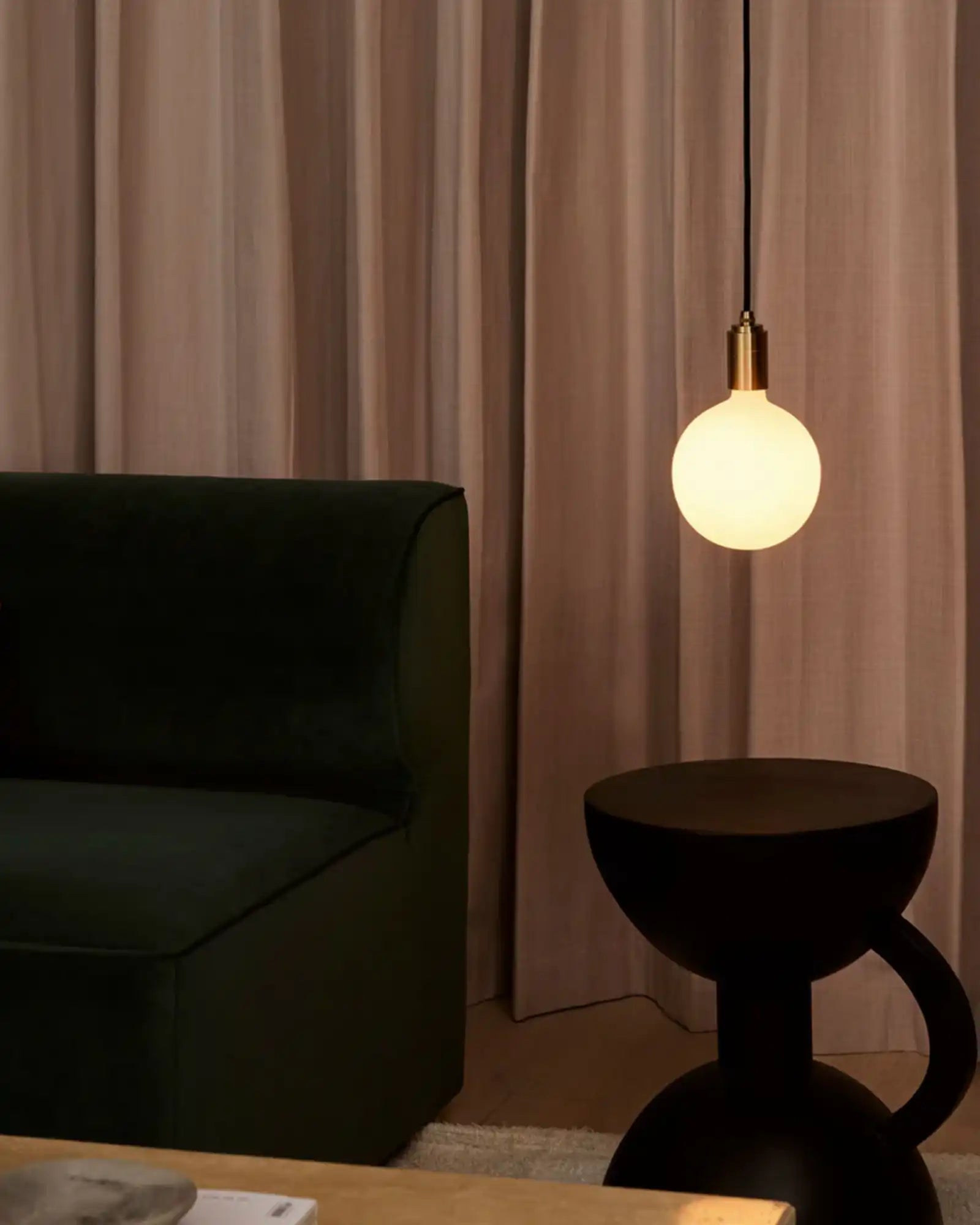 Sphere Plug-in Pendant Light by Tala featured within a contemporary living room | Nook Collections