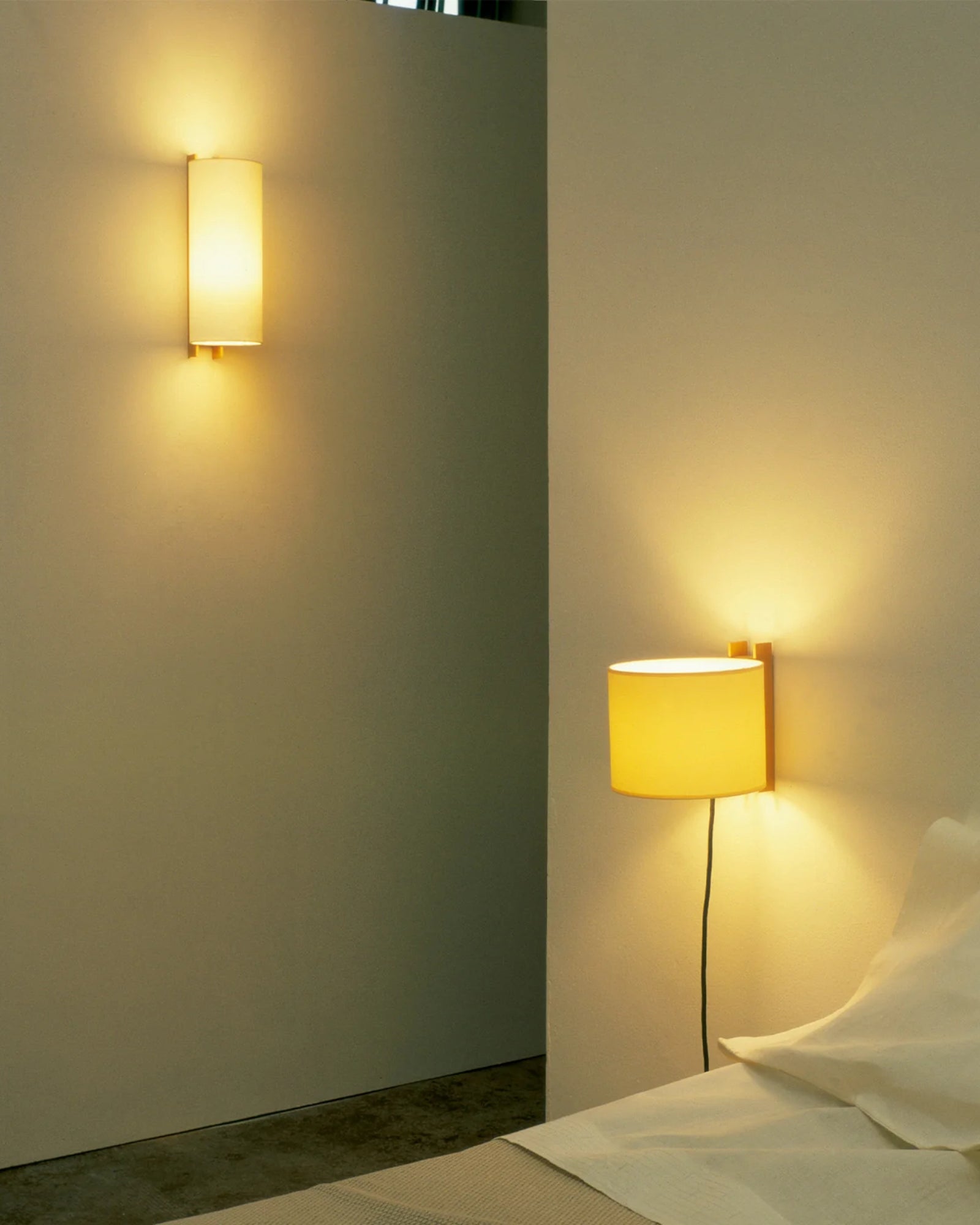 TMM Largo Wall Light by Santa & Cole featured in a modern contemporary bedroom | Nook Collections