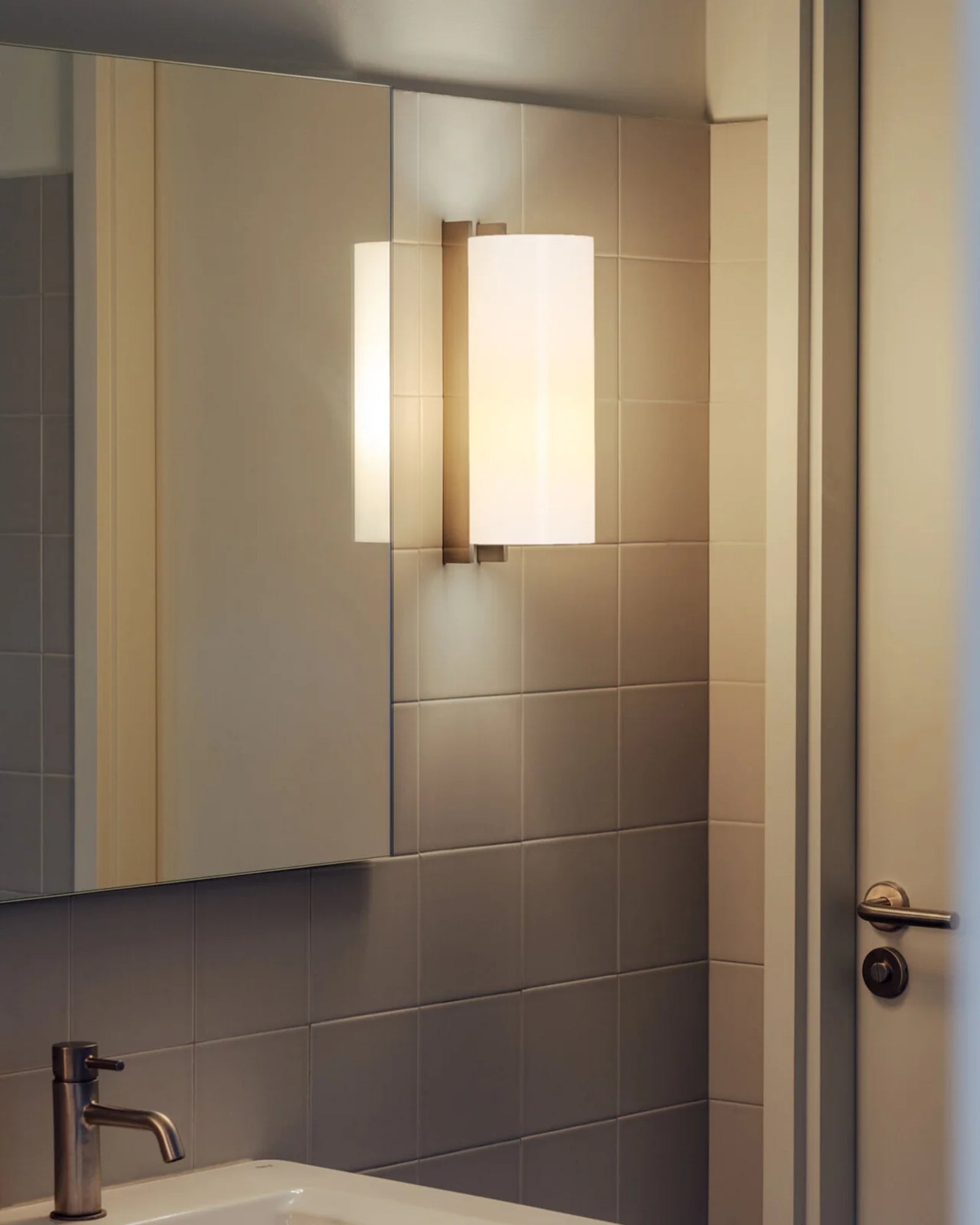 TMM Metalico Wall Light by Santa & Cole featured in a modern contemporary bathroom | Nook Collections