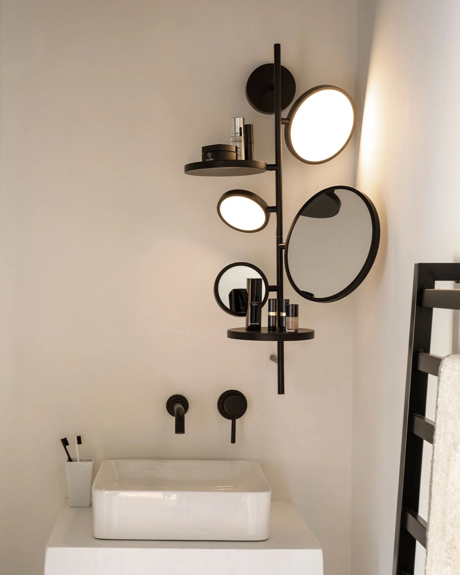 Tell Me Stories Wall Light by DCW Interiors featured in a modern contemporary powder room | Nook Collections