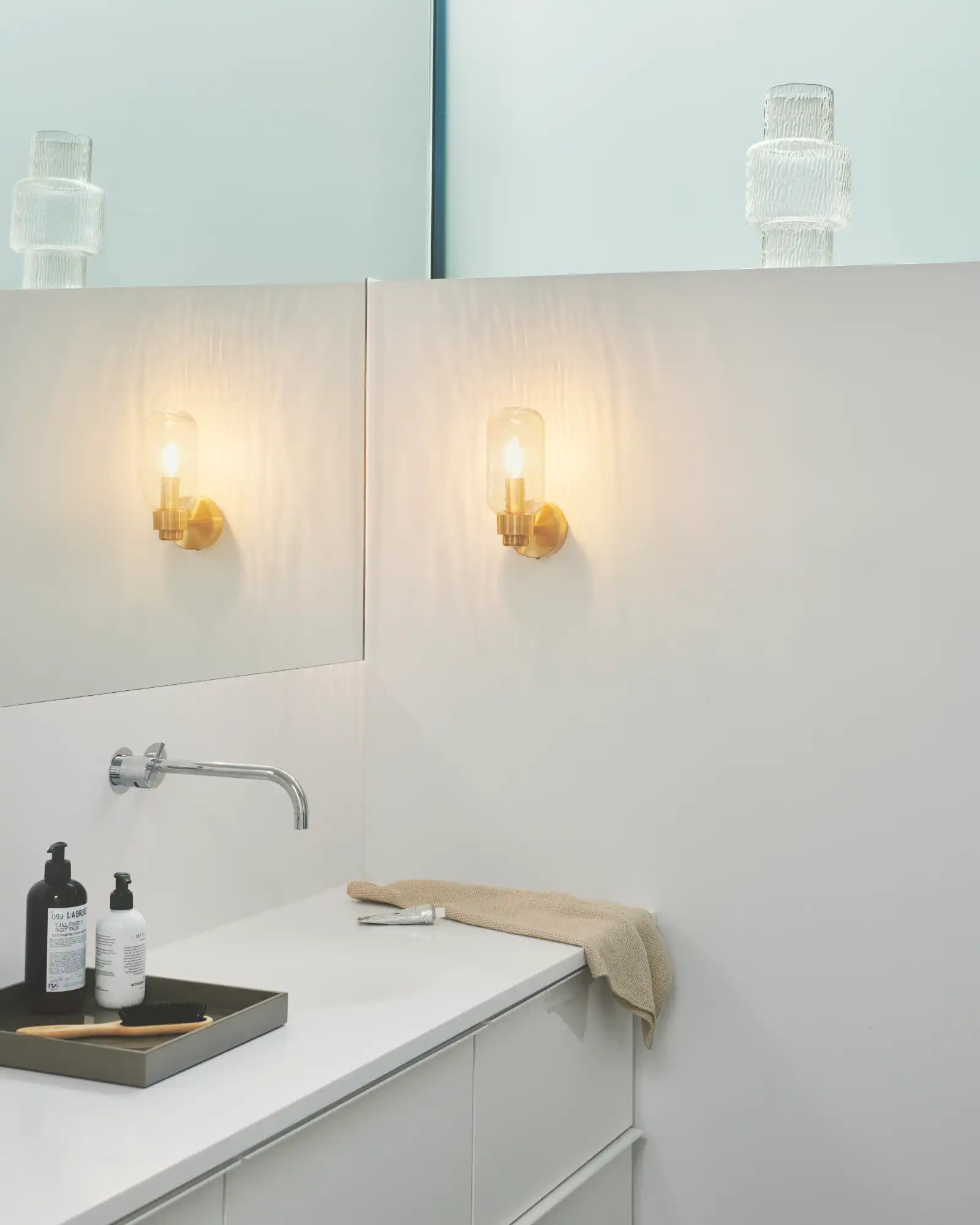 Tutan Wall Light by Nordlux Lighting featured within a contemporary bathroom | Nook Collections