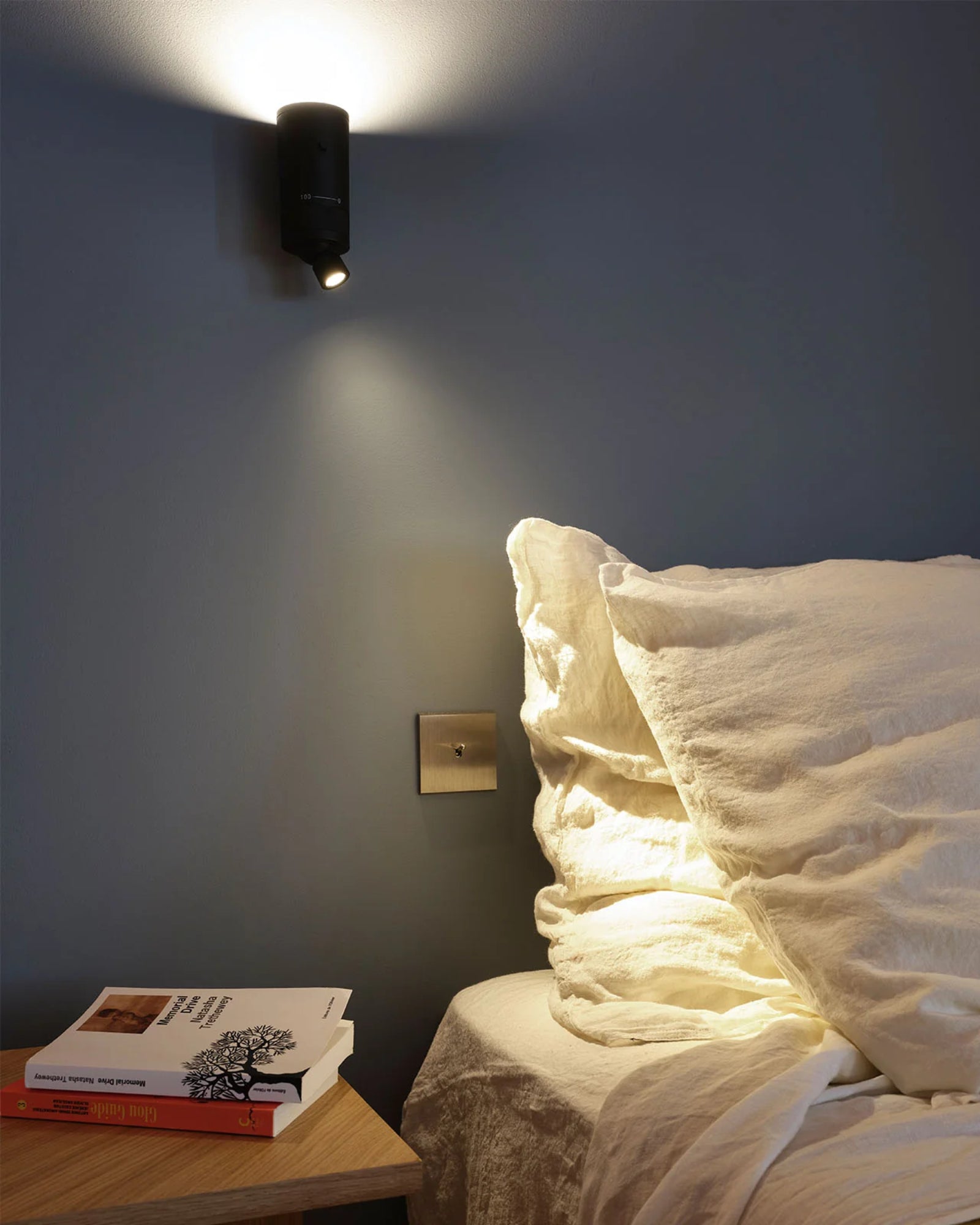 Vision Omni Wall Light by DCW Interiors featured in a modern contemporary bedroom | Nook Collections