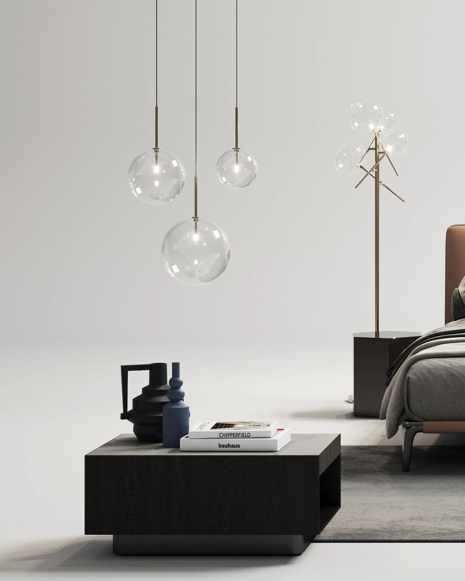 Modern living room with a coffee table, decorative items, and pendant lights.