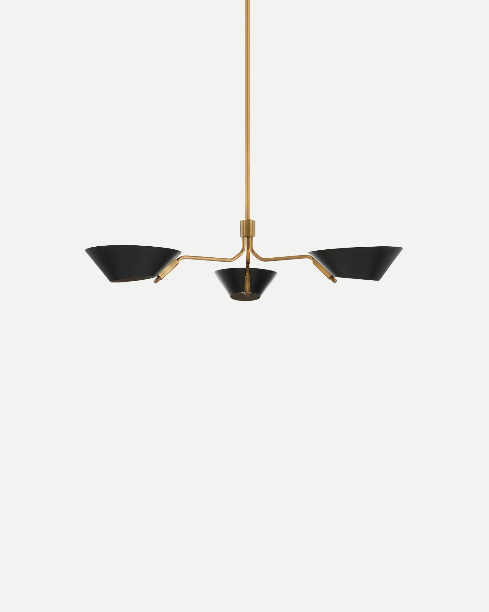 Modern pendant light with black shades and gold fixture on a white background