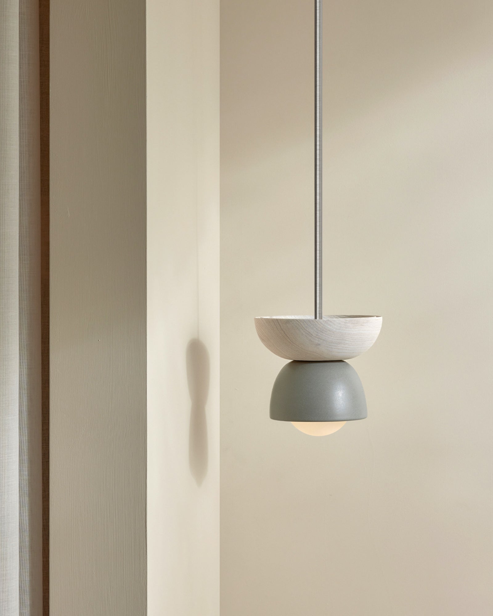 Terra 00 Rod Pendant Light with an ash wood finish, fog ceramic finish, and brushed black rod- Nook Collections