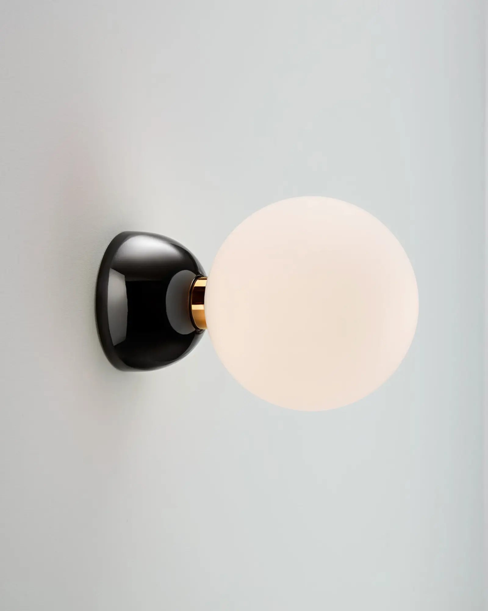 Aballs semi flush orb wall light with ceramic body and glass shade black