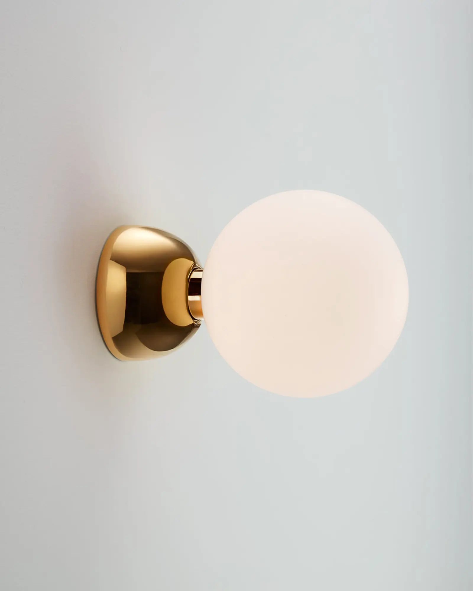 Aballs semi flush orb wall light with ceramic body and glass shade golden