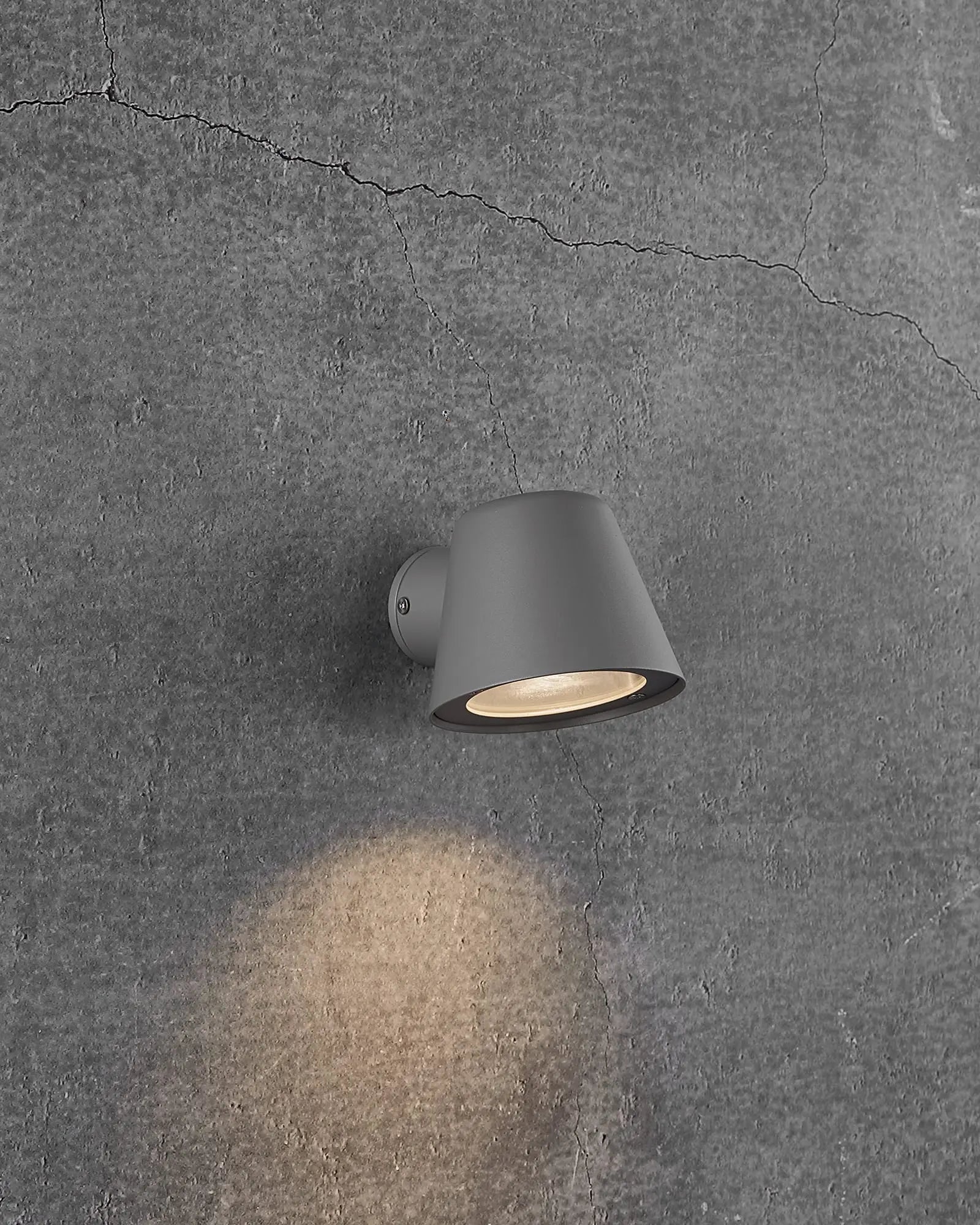 Aleria minimalistic Scandinavian Outdoor wall light on concrete wall in grey