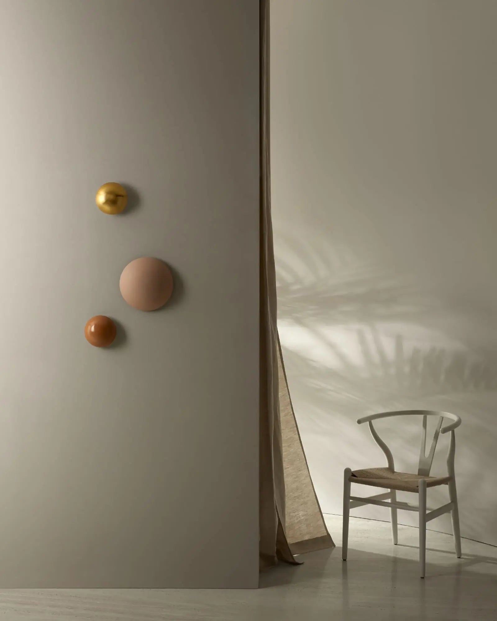 Altun contemporary curved disc wall light cluster in a lounge area