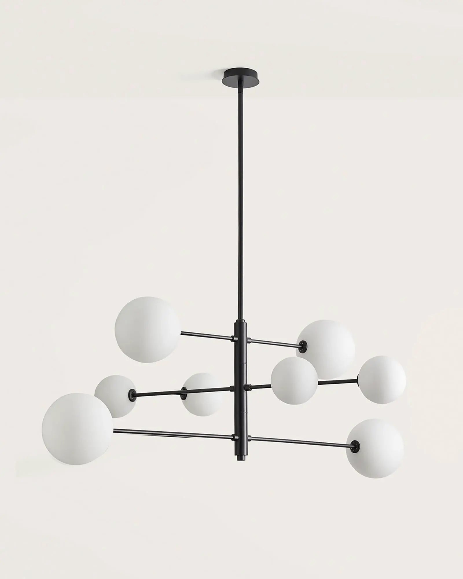 Atom contemporary adjustable pendant light in black and opal glass orb shades 