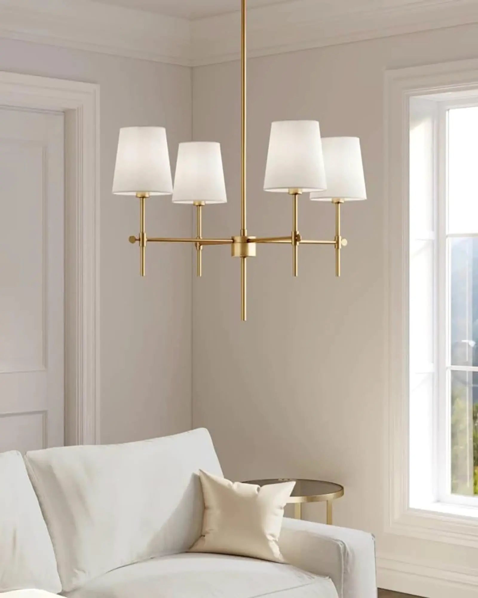 Baker Chandelier in brass above a sofa