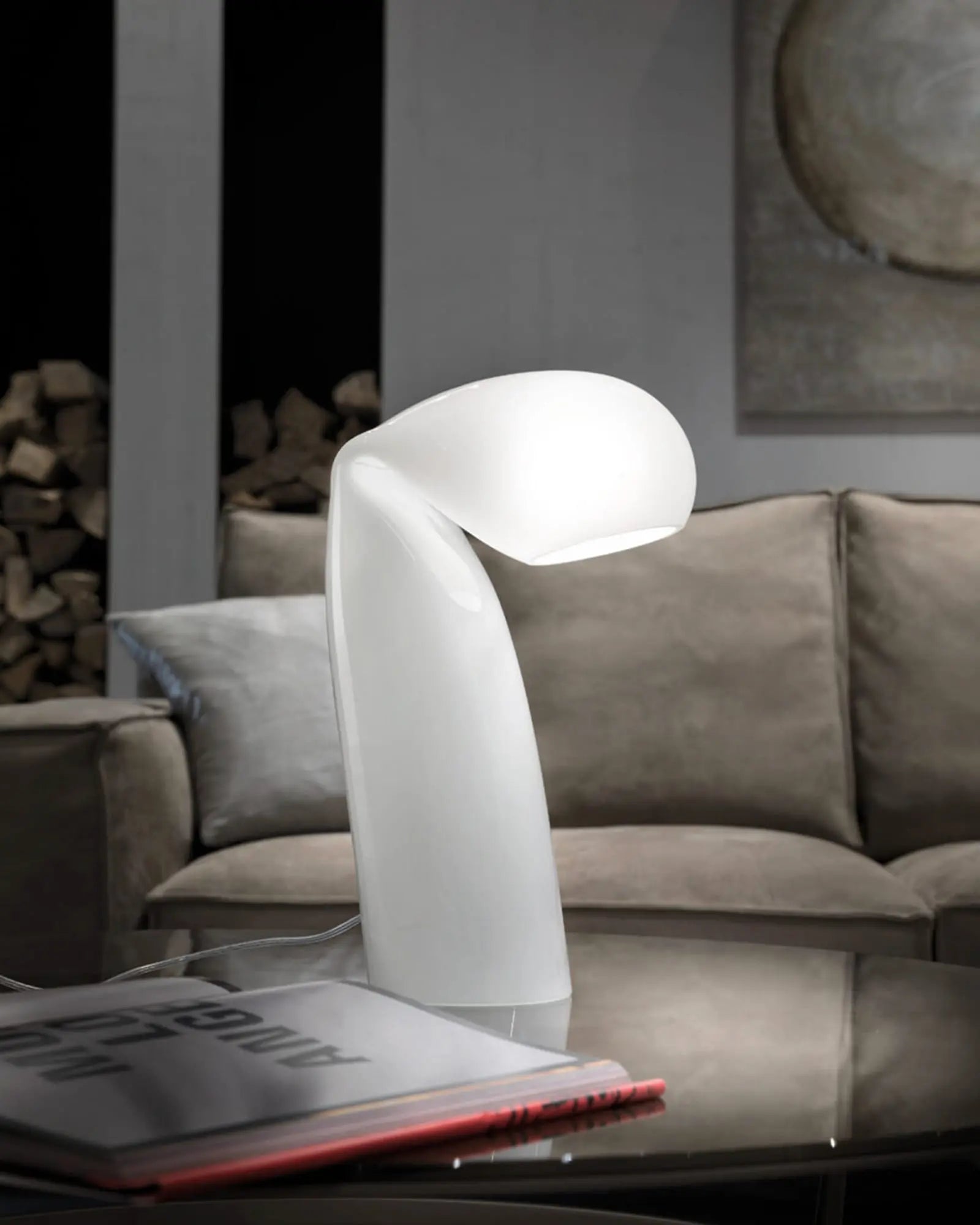 Bissa table lamp in murano mouth blown glass on a coffee table