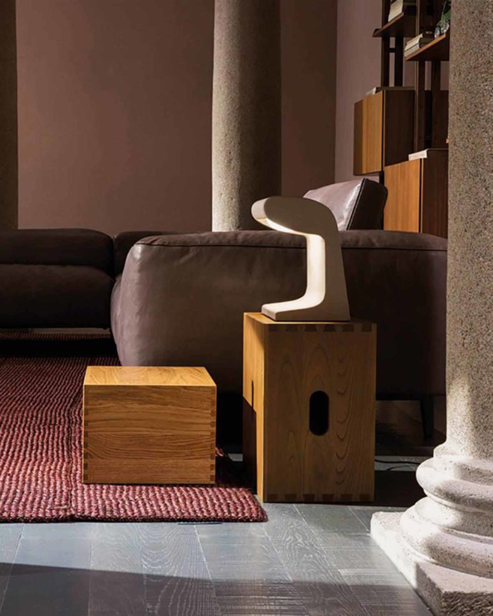Born Breton Contemporary iconic floor lamp on a coffee table near a sofa