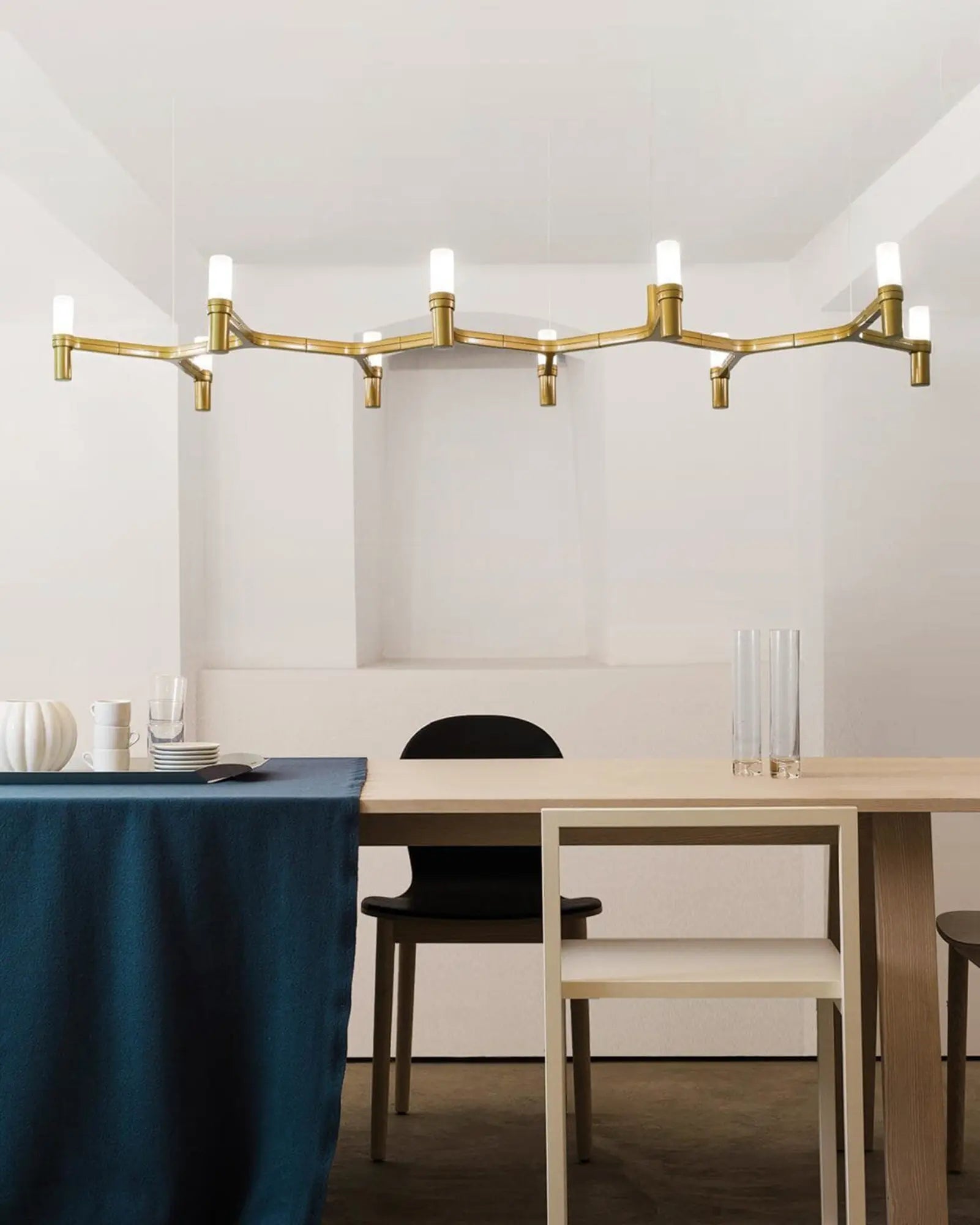 Crown plana long horizontal pendant light above a dining table