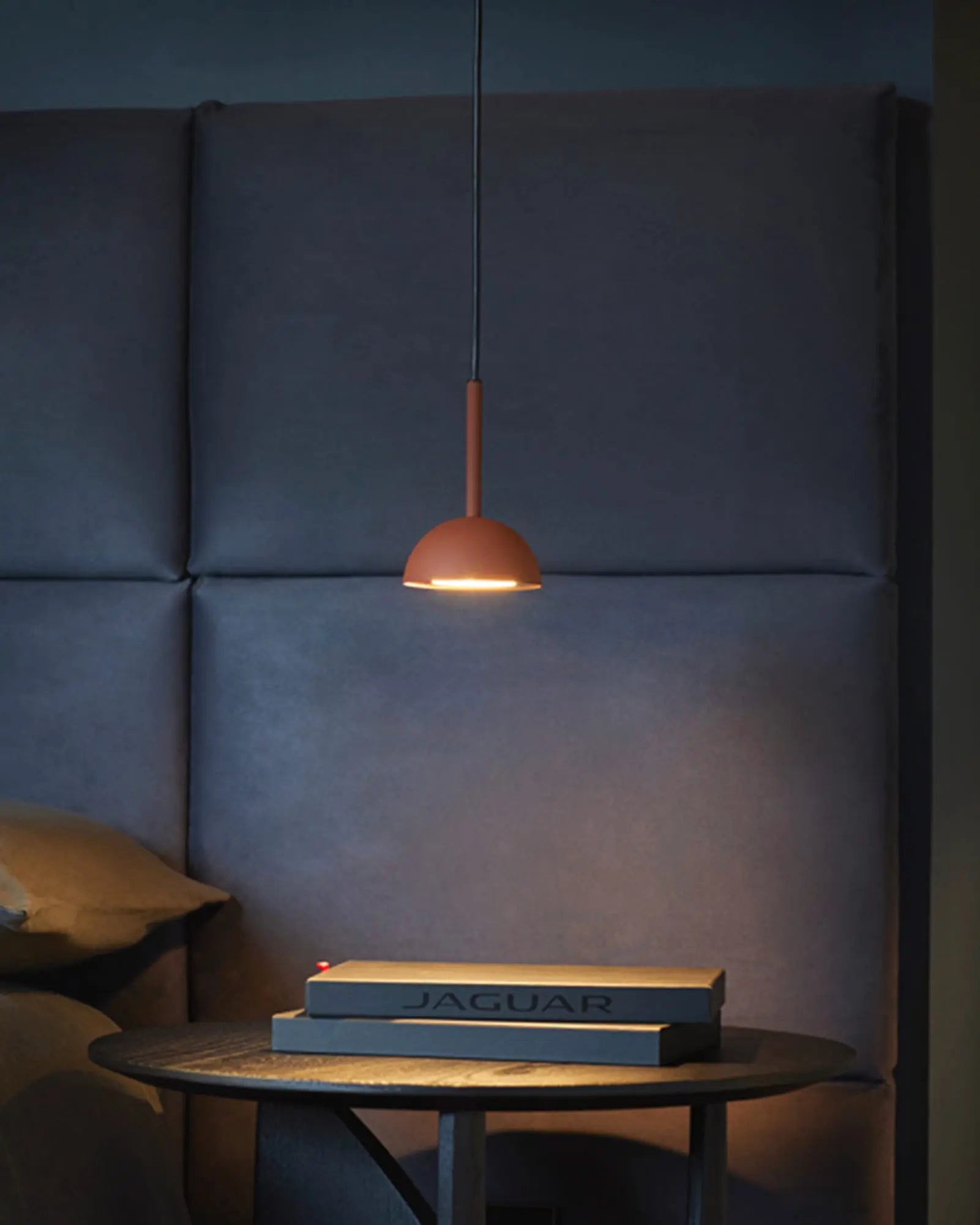 Cupolina single pendant above a bedside table