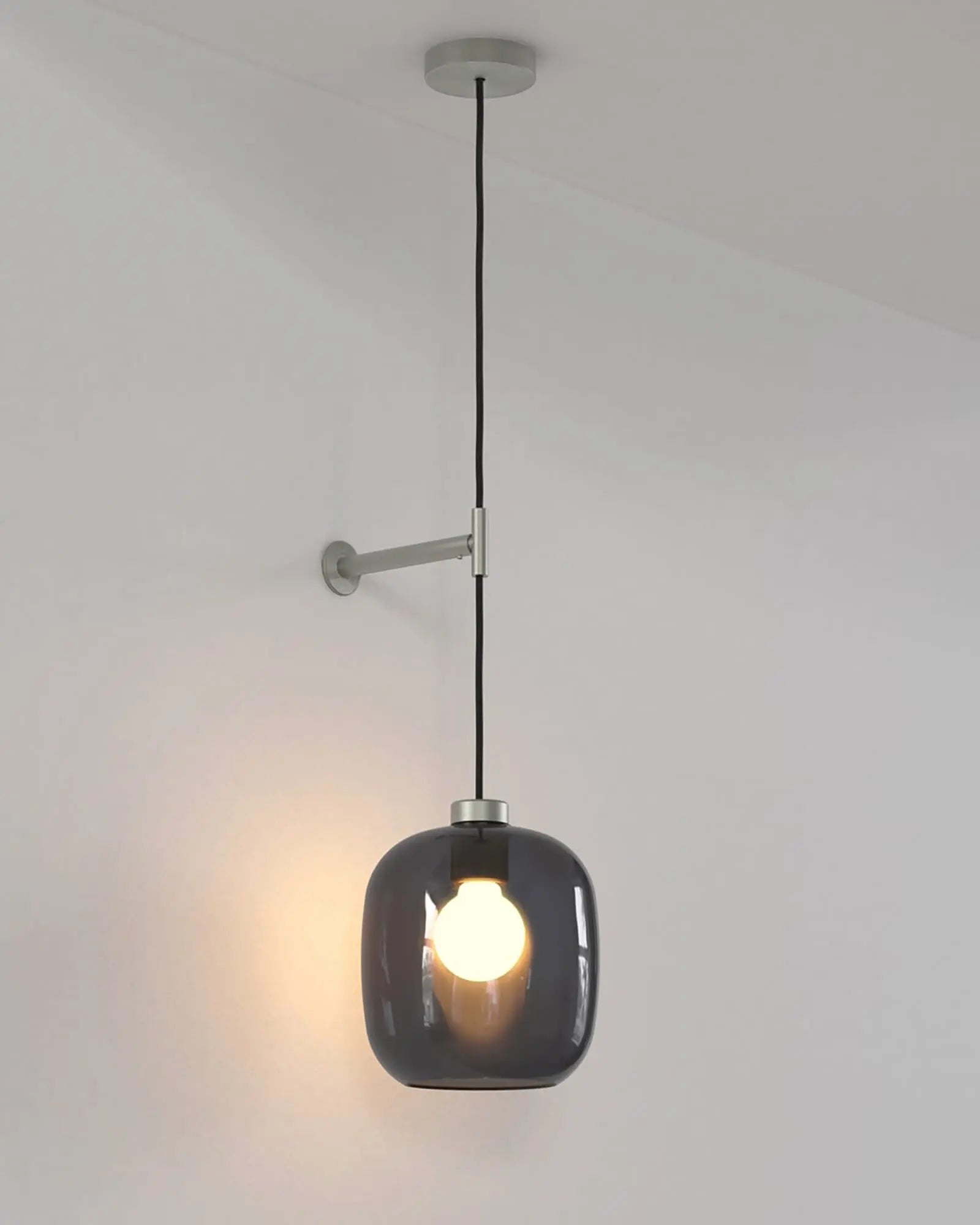 Curve contemporary pendant light with wall mount and smoke blown glass shade nickel small