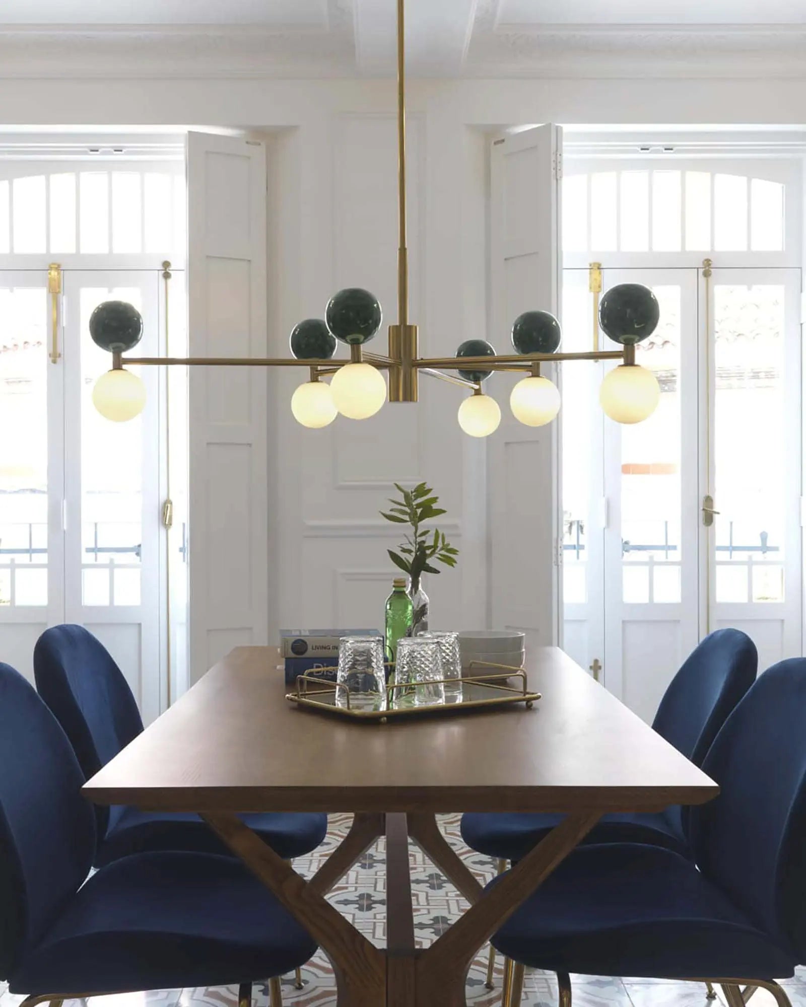 Dalt 6 pendant light marble and opal spheres above a dining table