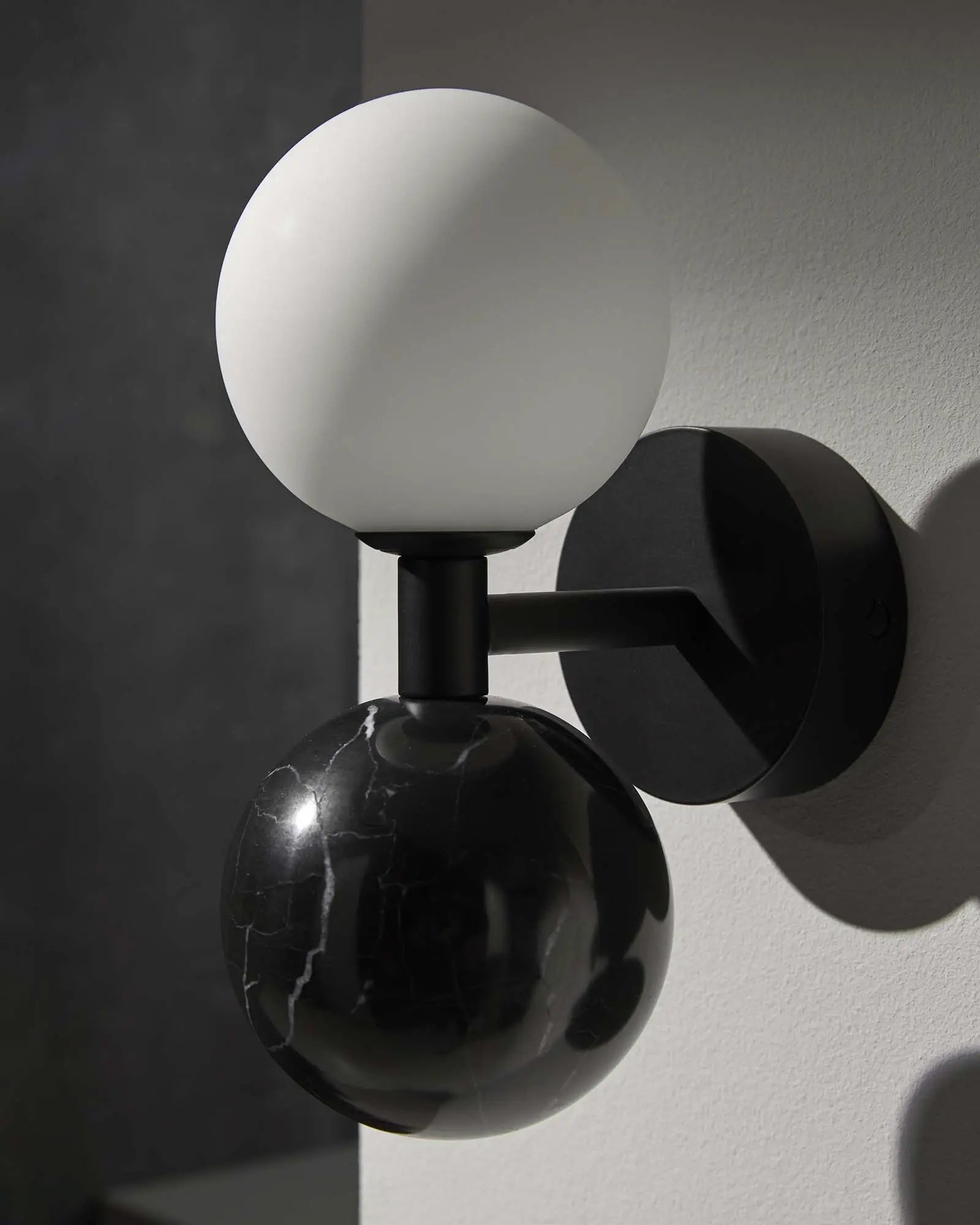 Dalt Wall light marble and opal glass spheres detail