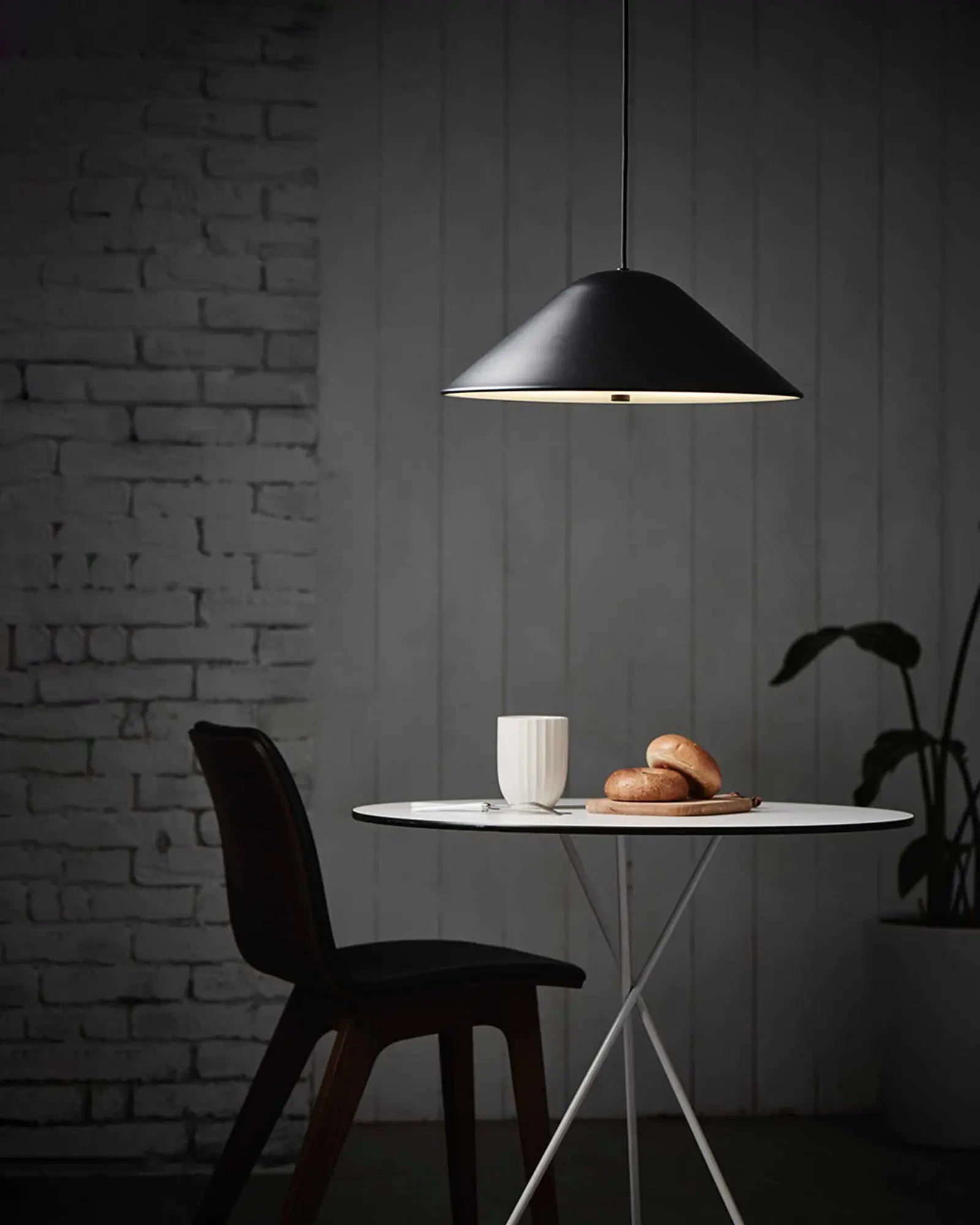 Damo contemporary dome pendant light above a round table