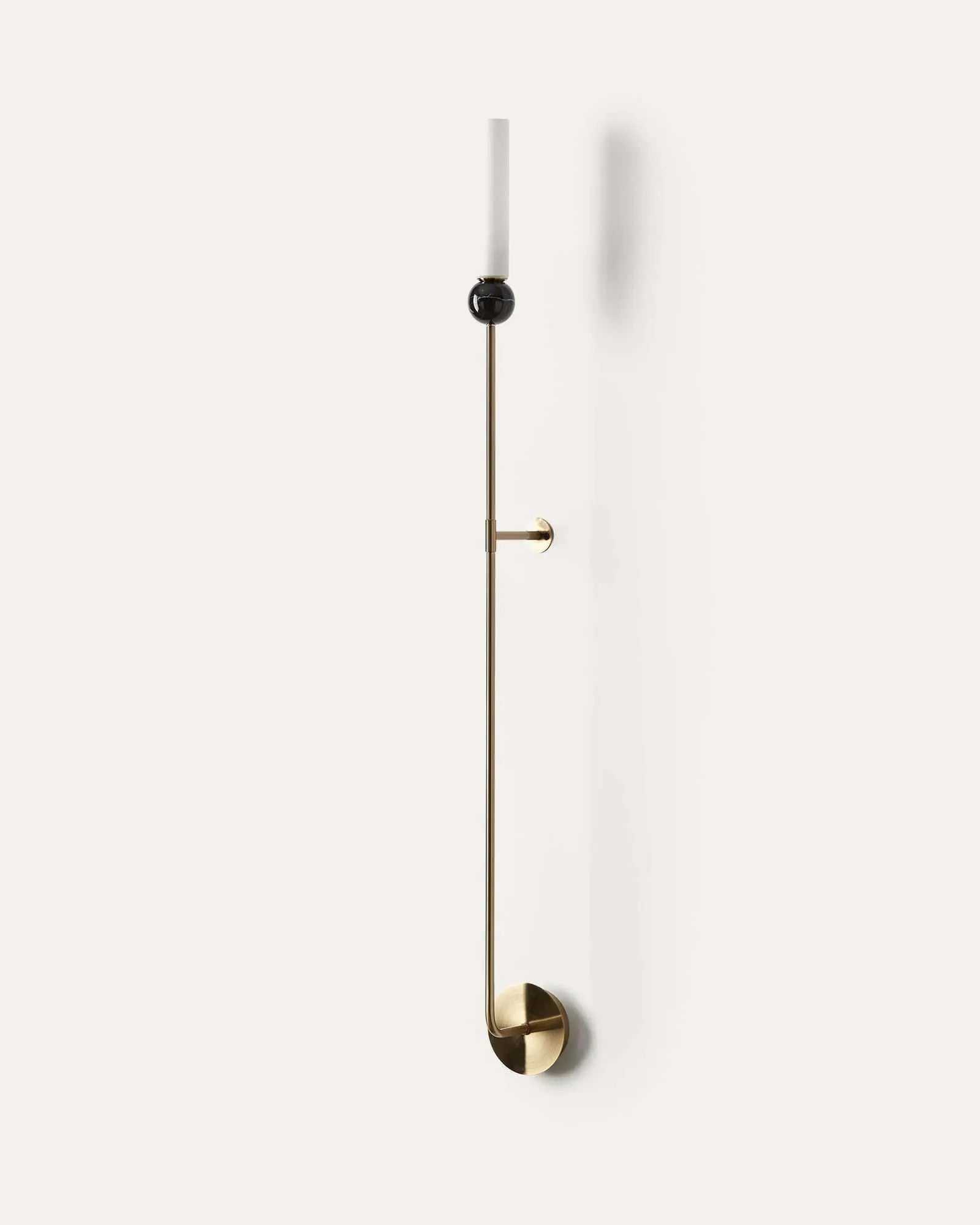 Delie Long wall light with marble black sphere and cylindrical opal shade brass