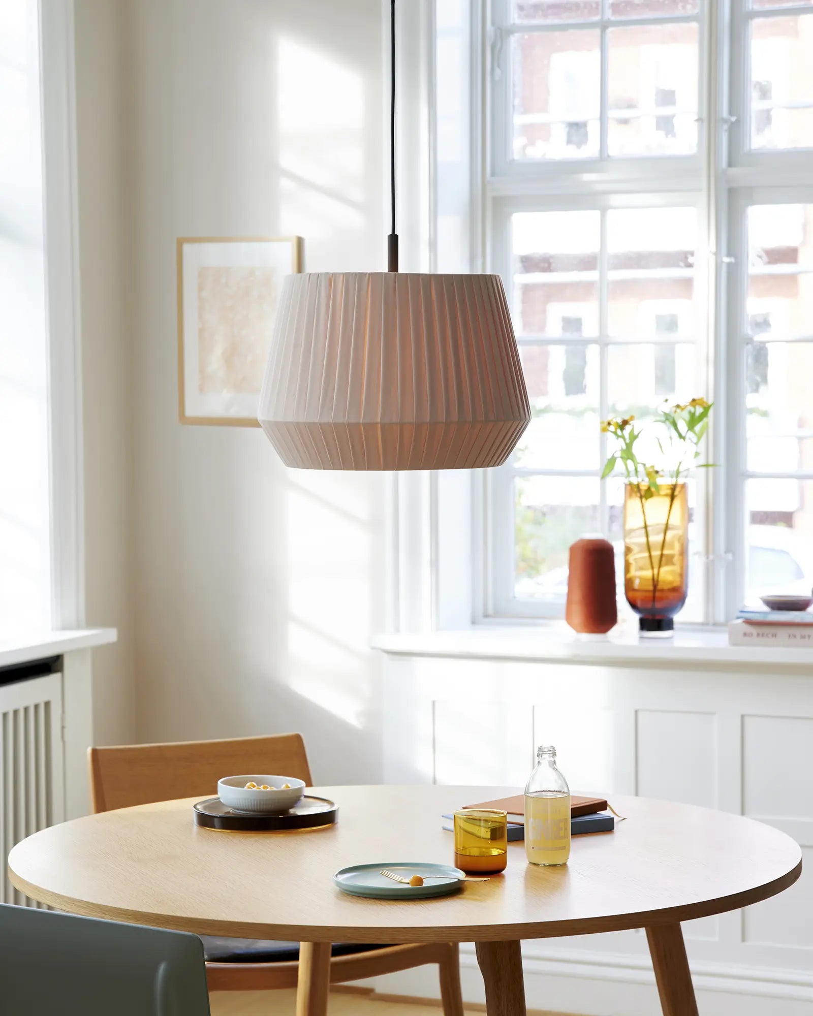 Dicte fabric scandinavian pendant light above a table