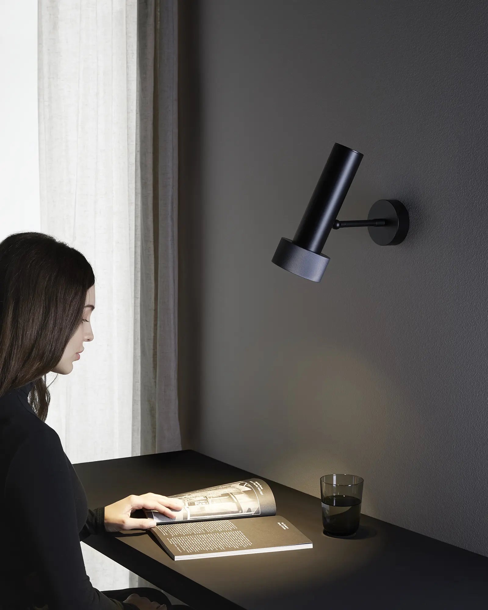 Focus wall light adjustable over a desk