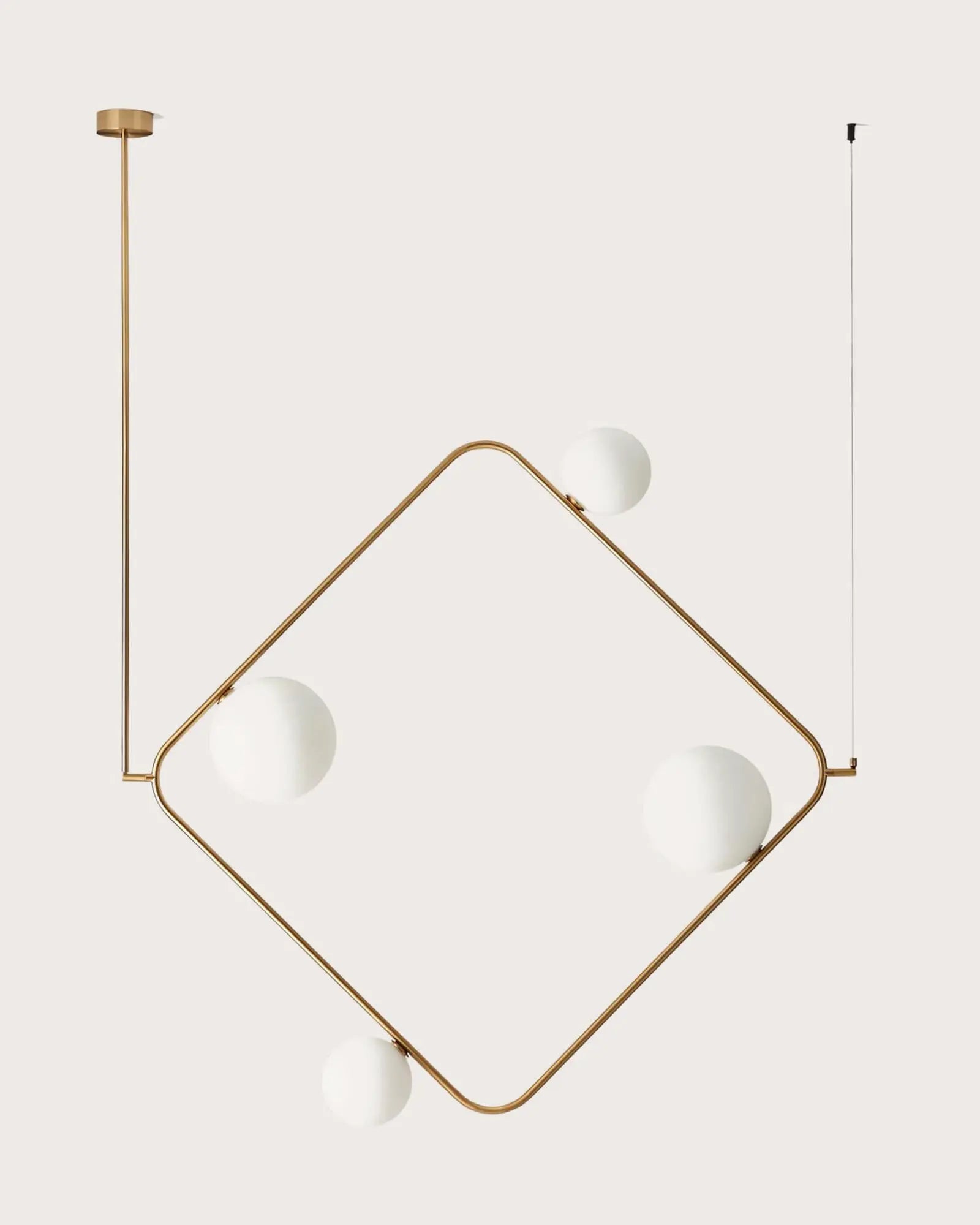 Gruye Geometric pendant light with orb opal glass shades brass