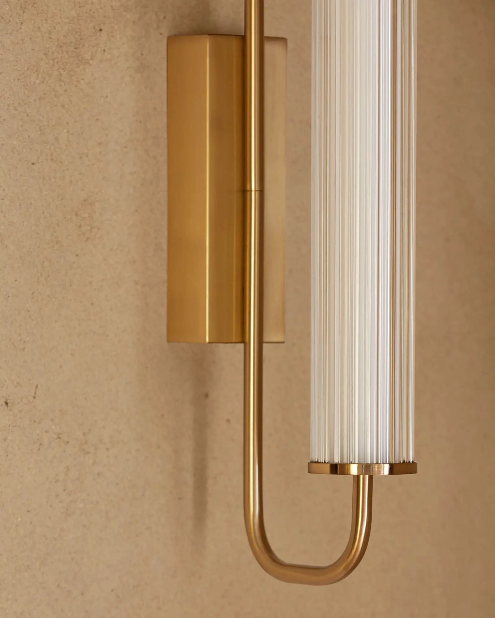 Ison wall light with ribbed glass shade detail
