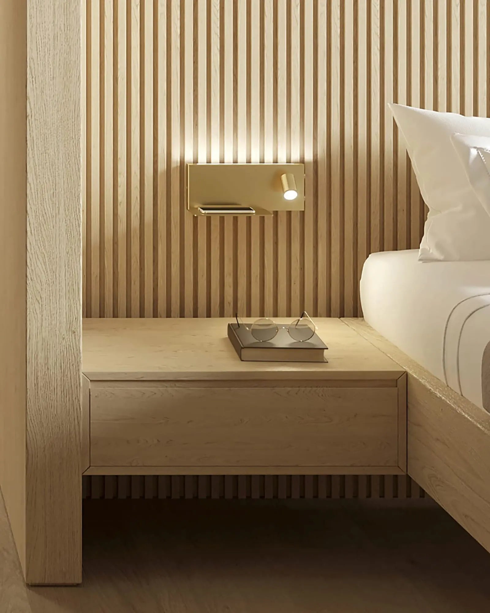 Jay wall light in a hotel room bedside