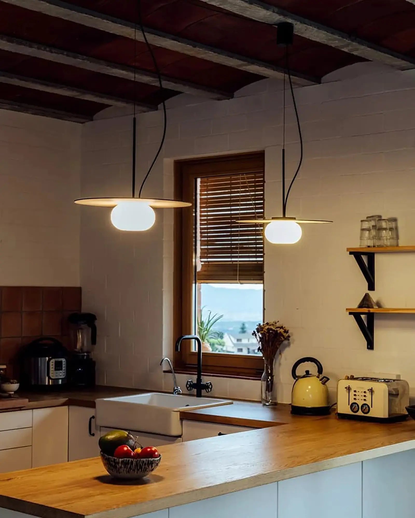 Knock pendant light cluster above a benchtop