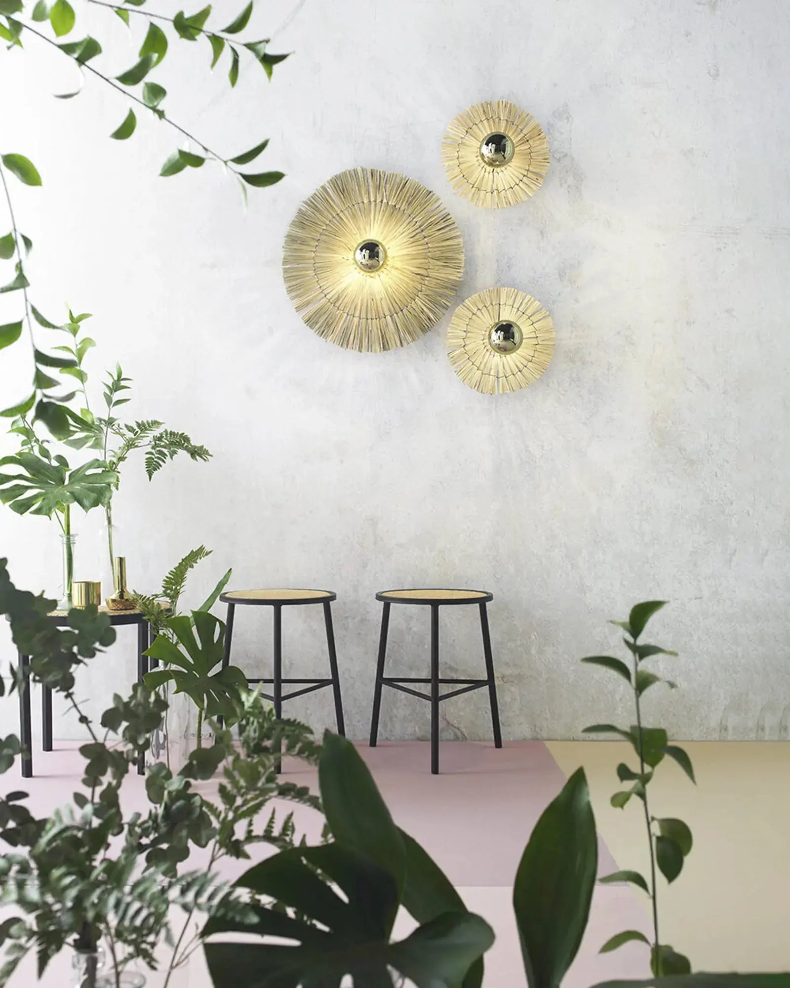 Laos wall light cluster above stools in a cafè