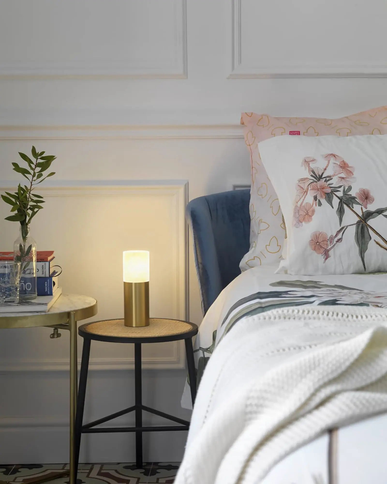 Lind minimalistic rechargeable table lamp in metal and alabaster in brass on the bedside table