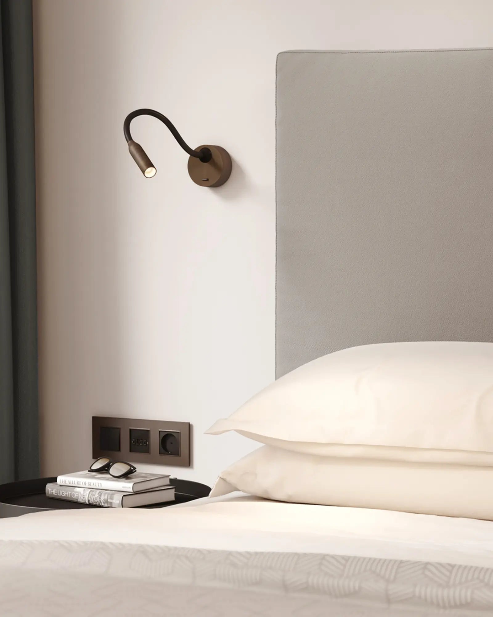 Lucca adjustable contemporary spot light with long stem on a bed side
