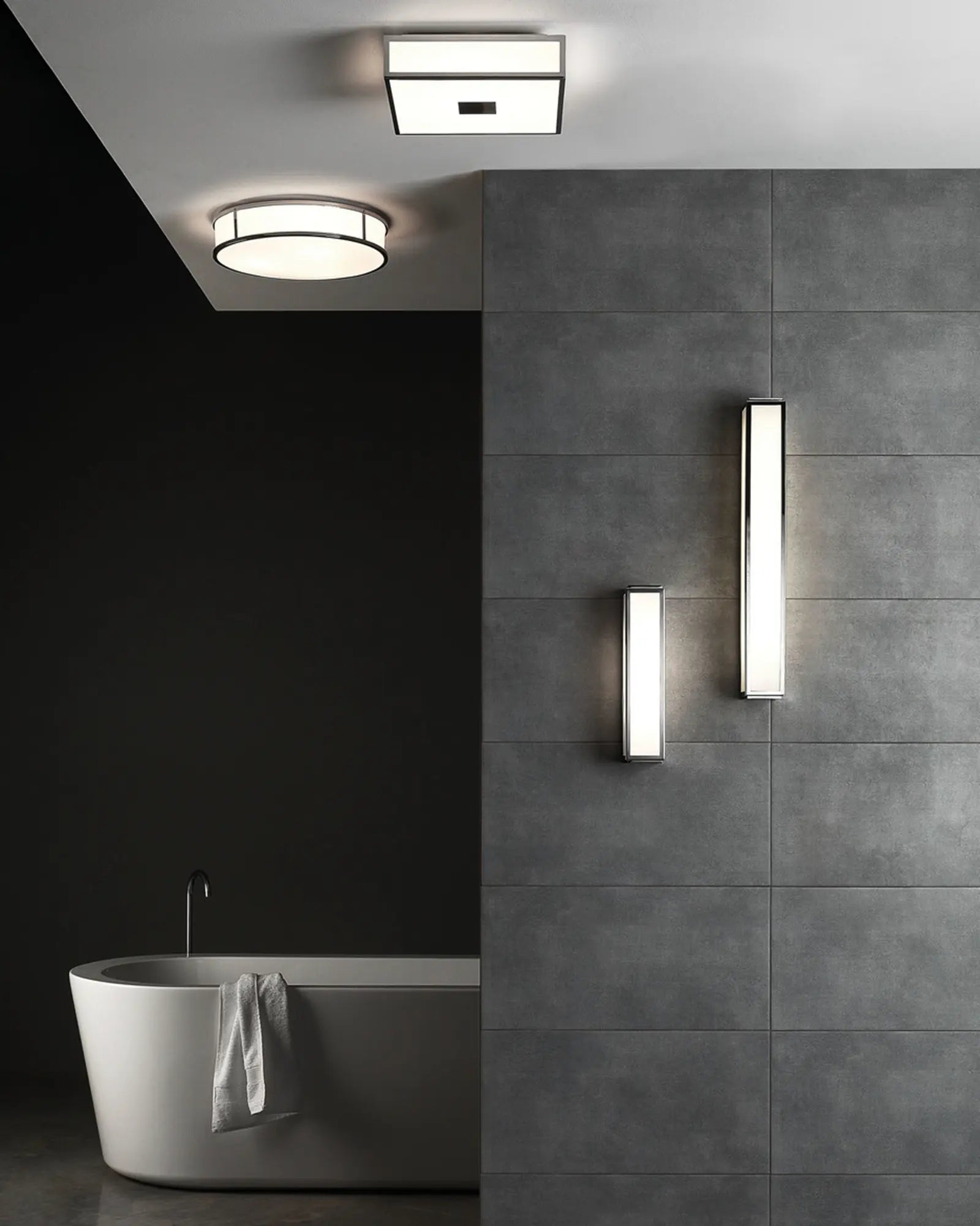 Mashiko metal and glass contemporary bathroom wall light on grey tiles
