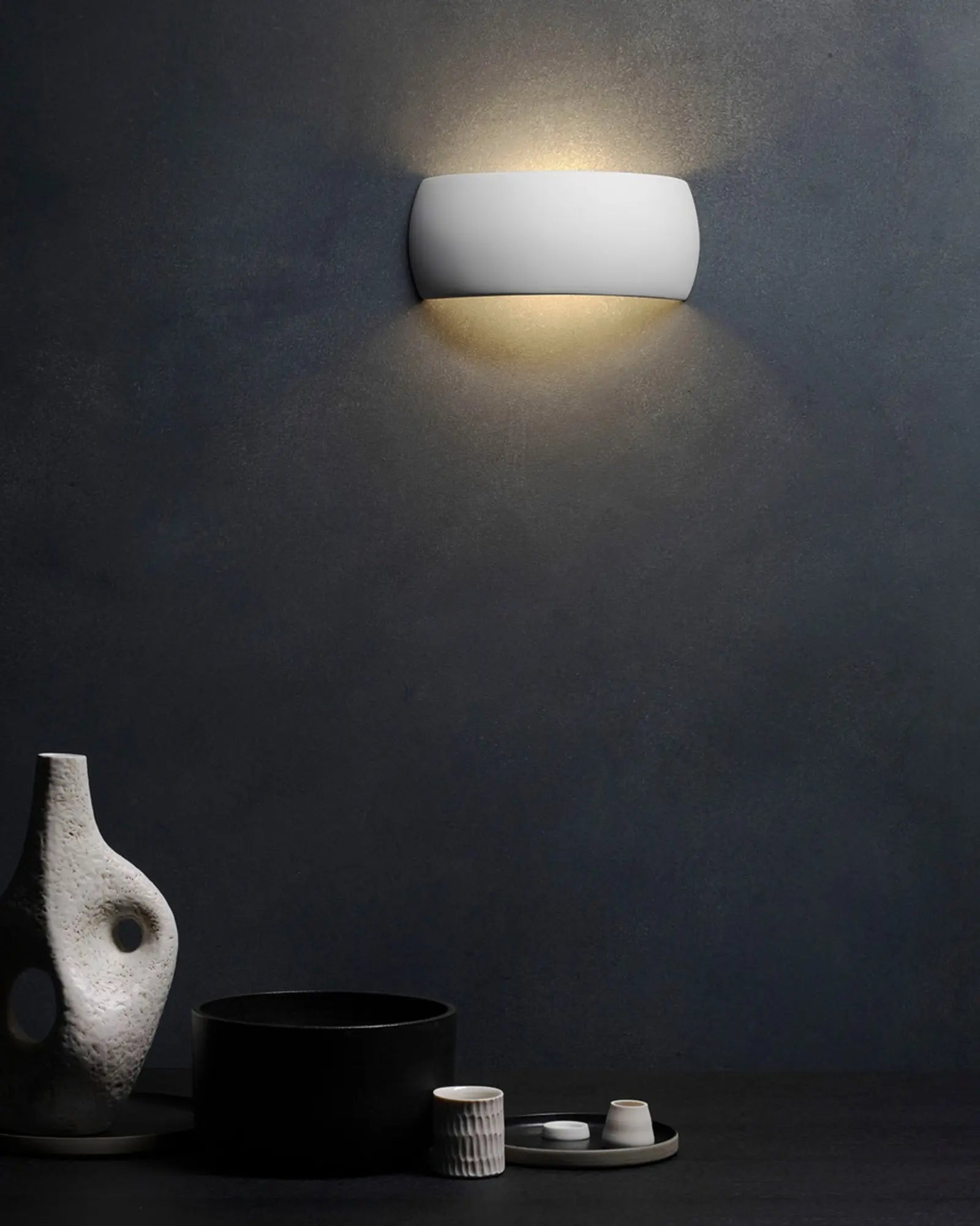 Milo ceramic contemporary wall light above a shelf