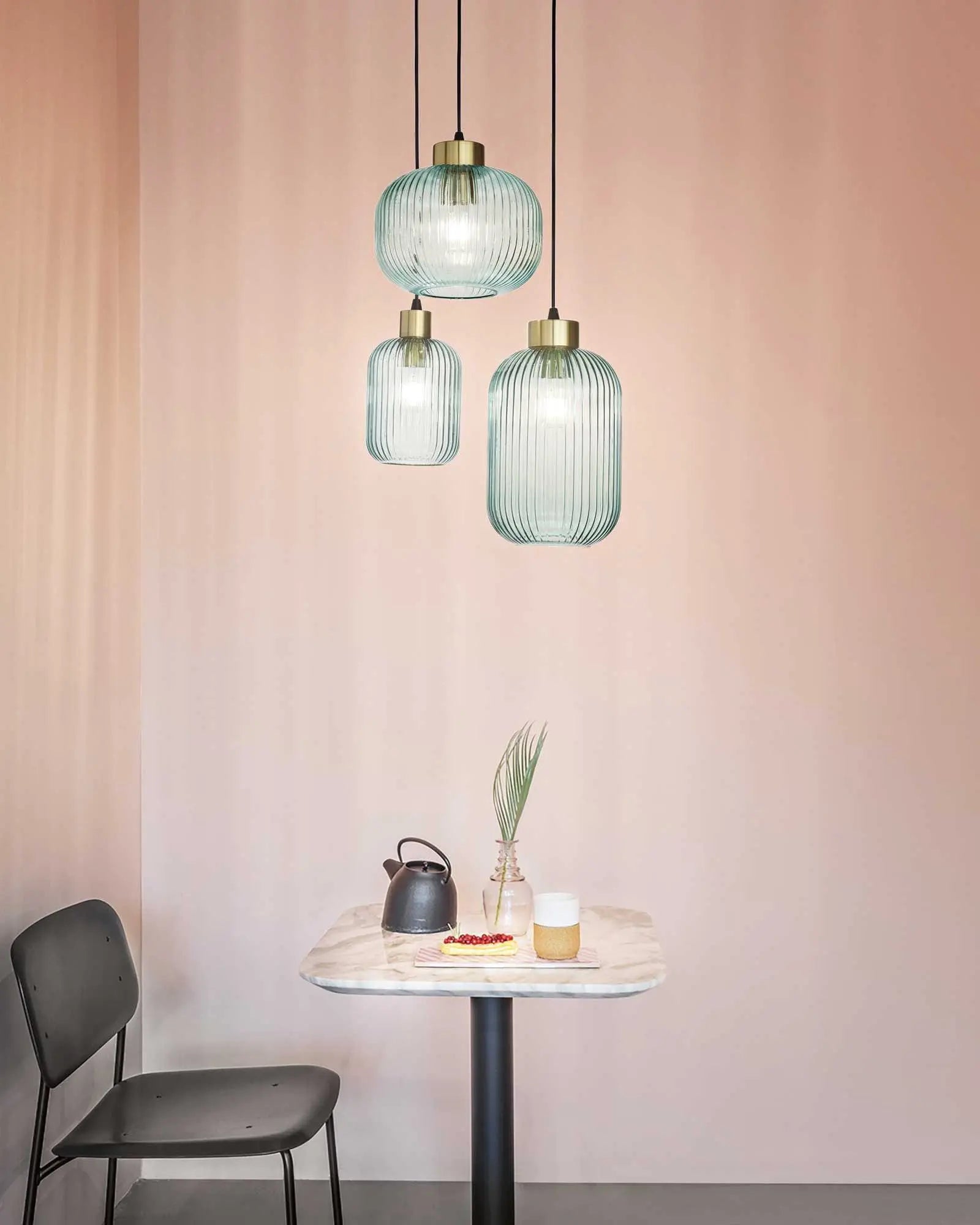Mint Blown glass pendant light cluster above a table