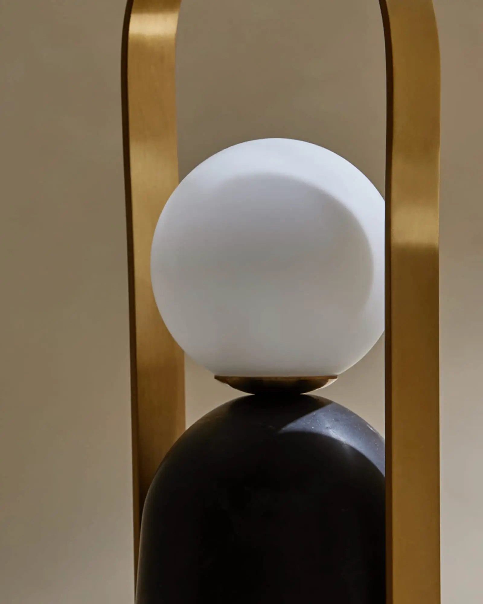 Nano Portable opal glass orb shade and brass handle table lamp detail
