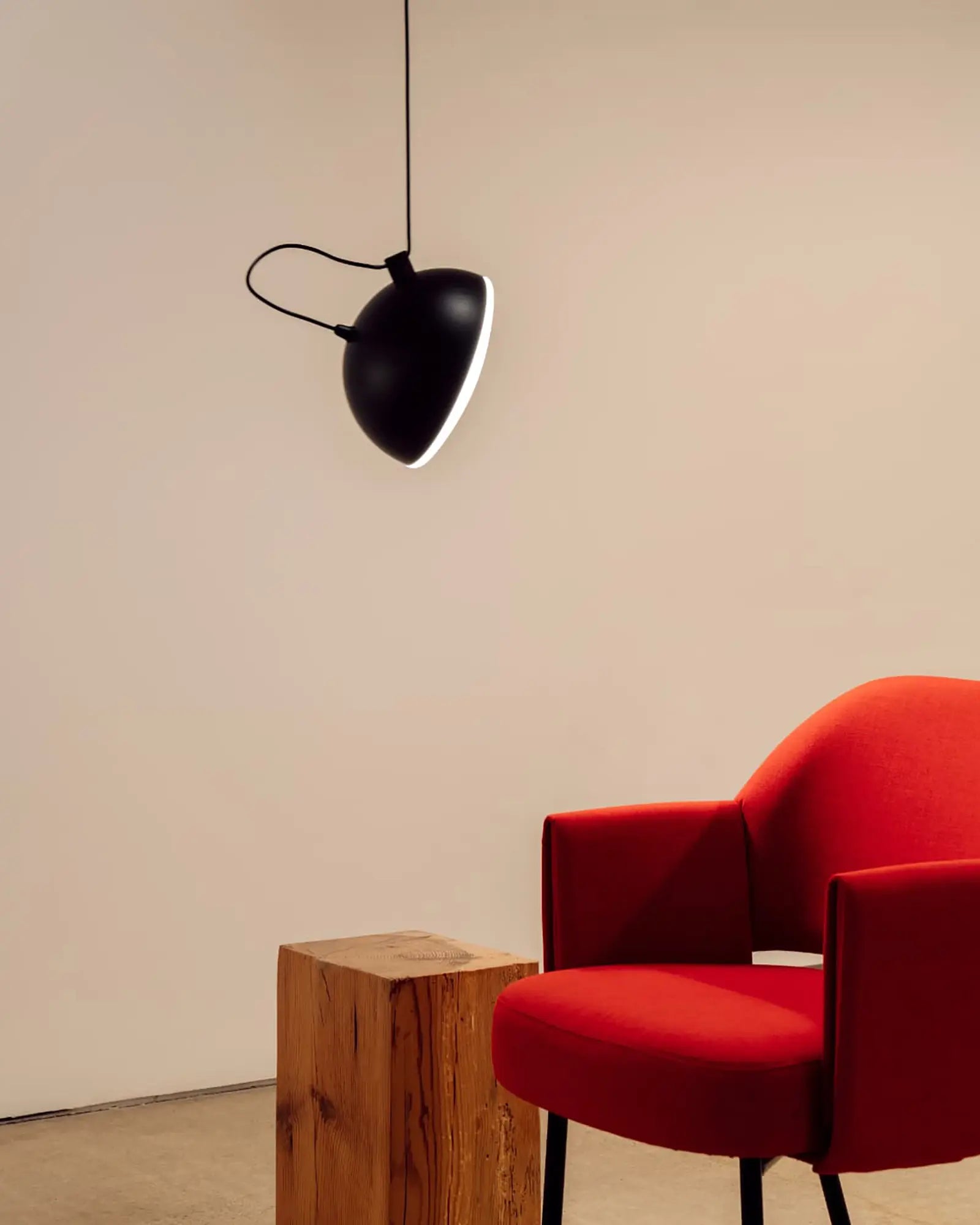 Nod pendant light above a reading chair
