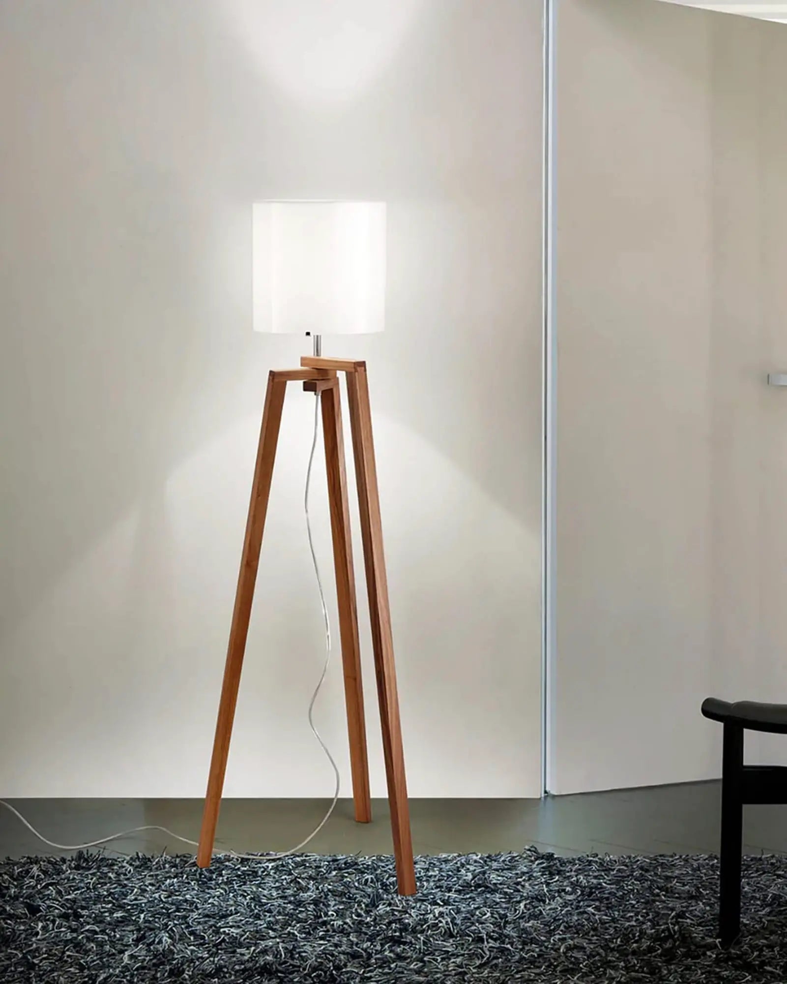 Trepai timber and glass contemporary floor lamp in a bedroom