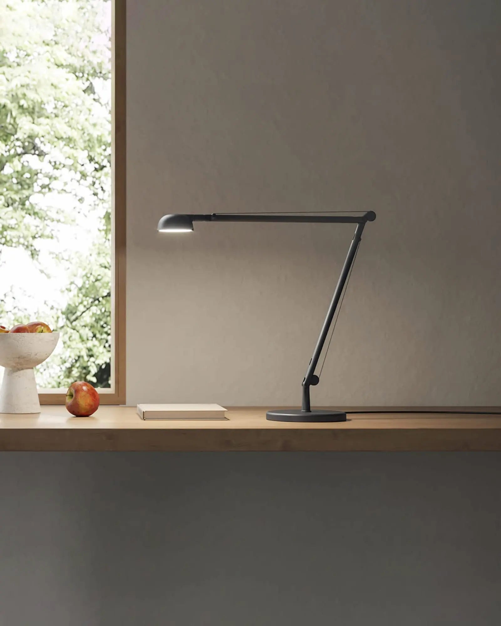 Optunia contemporary adjustable table lamp on a shelf