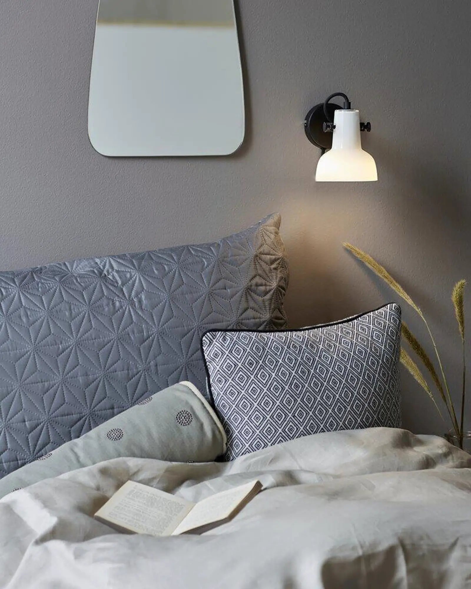 Parson adjustable wall light in a bedroom