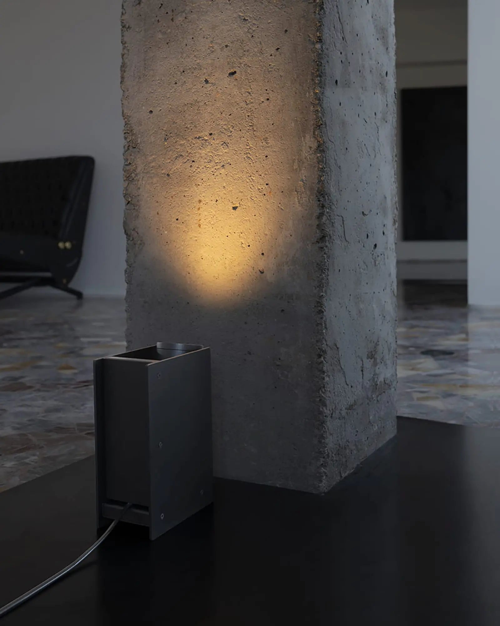 Plint adjustable minimal rectangular floor lamp near a column