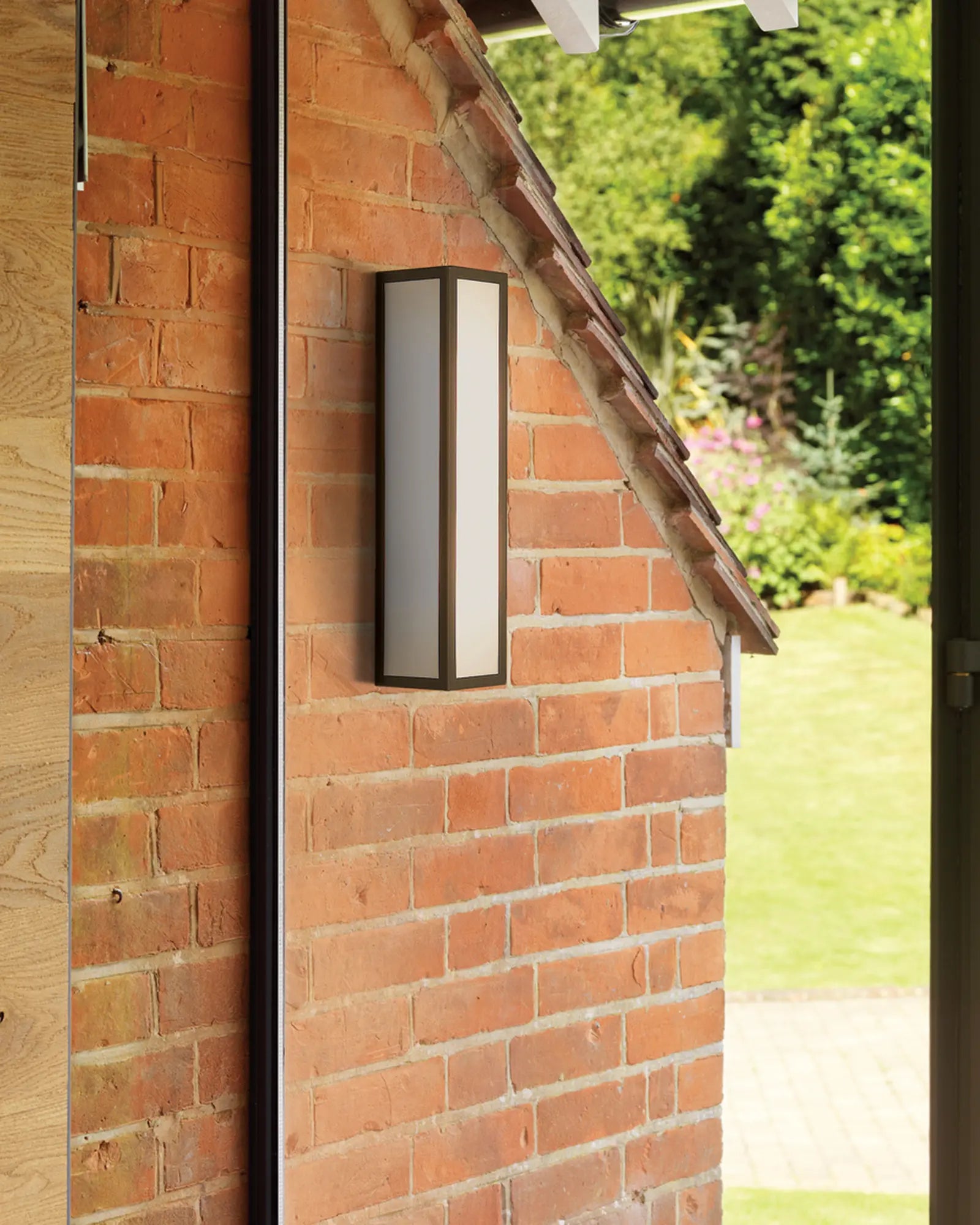 Salerno metal and opal glass rectangular contemporary wall light on a brick wall outdoor
