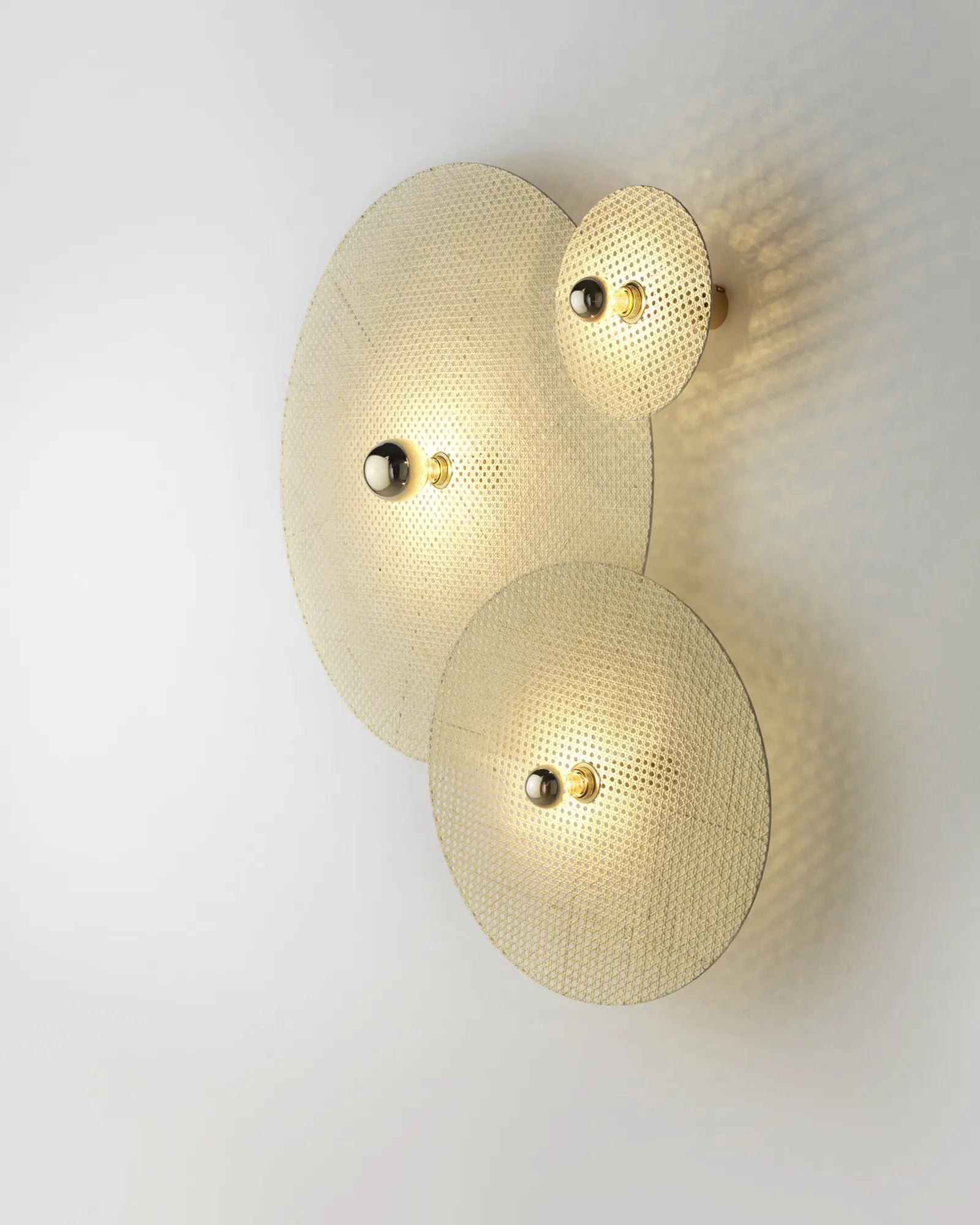 Tan Tan rattan contemporary round shade wall light side view