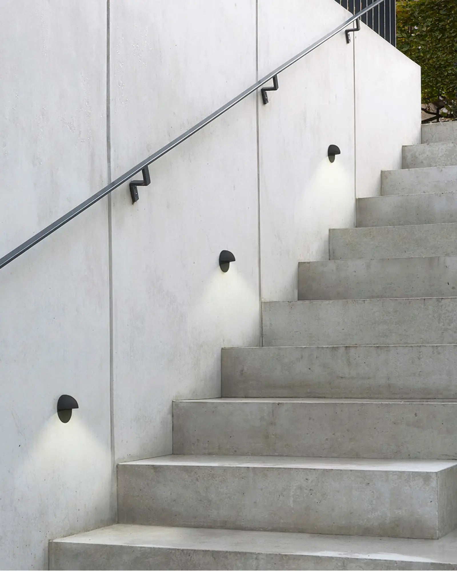 Tivola outdoor minimalistic wall light on a wall of a staircase