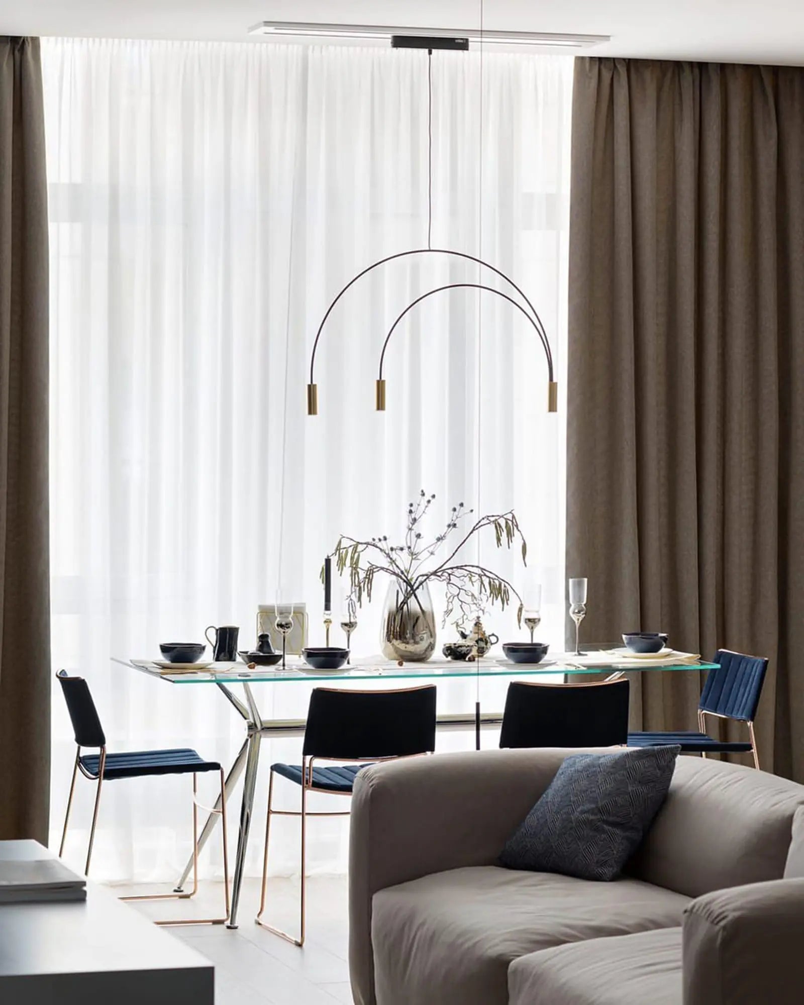 Volta Linear pendant light above a dining table