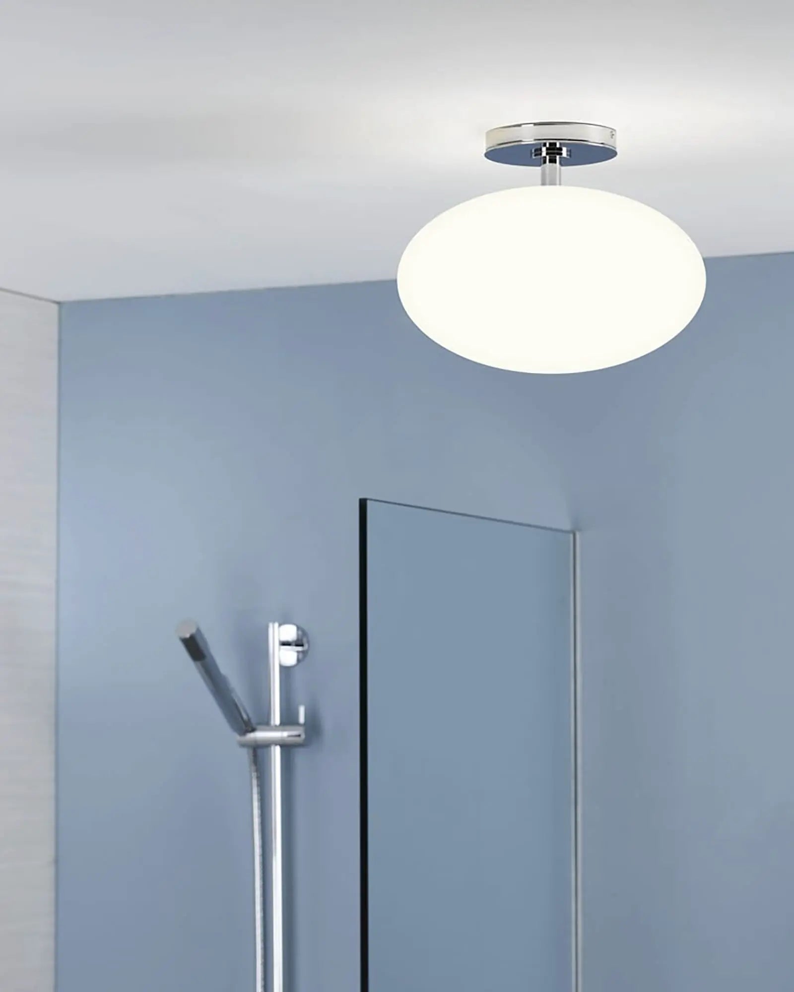 Zeppo orb glass ceiling light in a bathroom near the shower